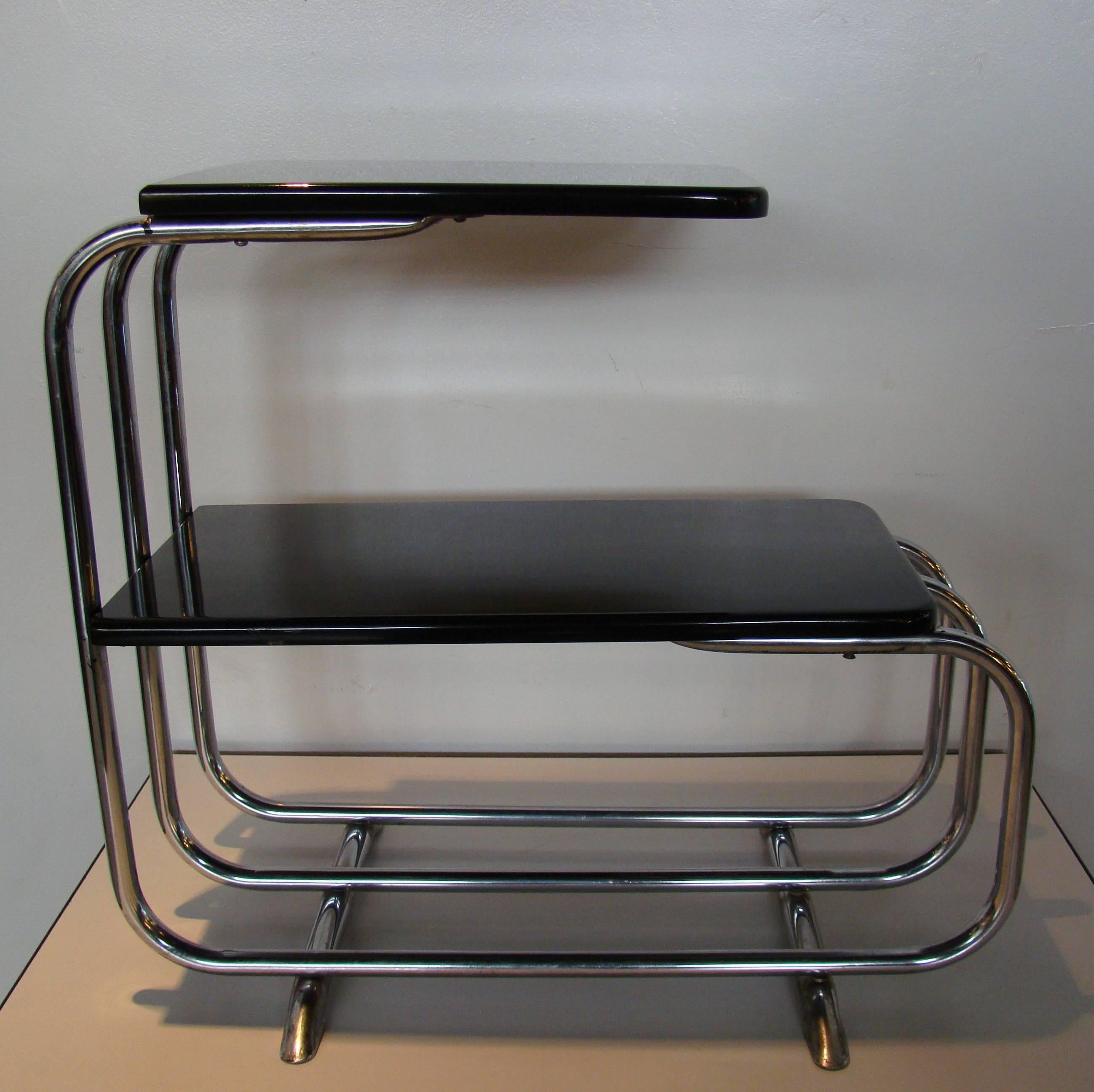 Beautiful chrome black machine age table by Alfons Bach for Lloyd, circa 1930s. Sleek and slender, this table will work in so many different interiors. Retains partial Lloyd label on the underside.