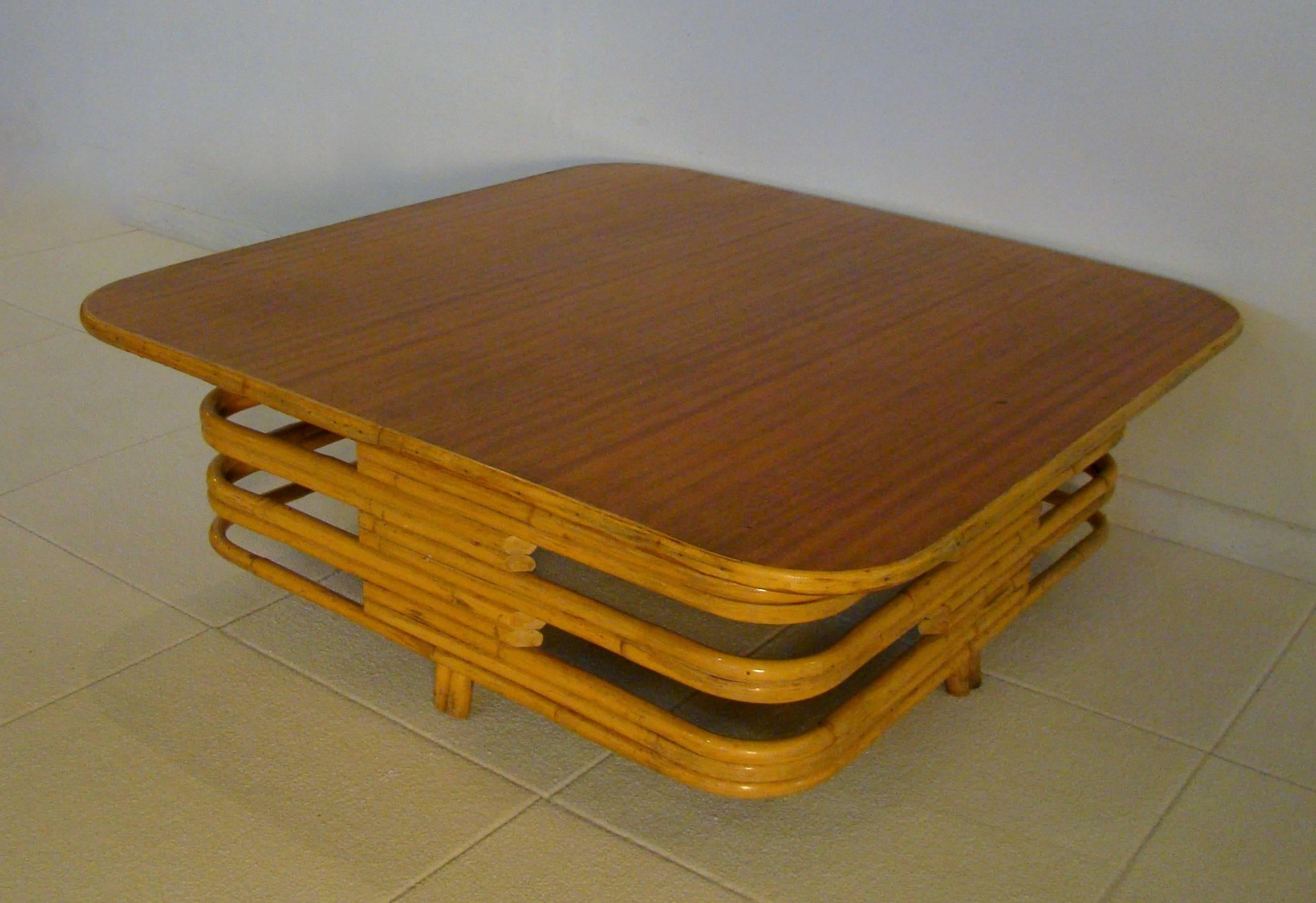 Large square rattan coffee table with laminate top.