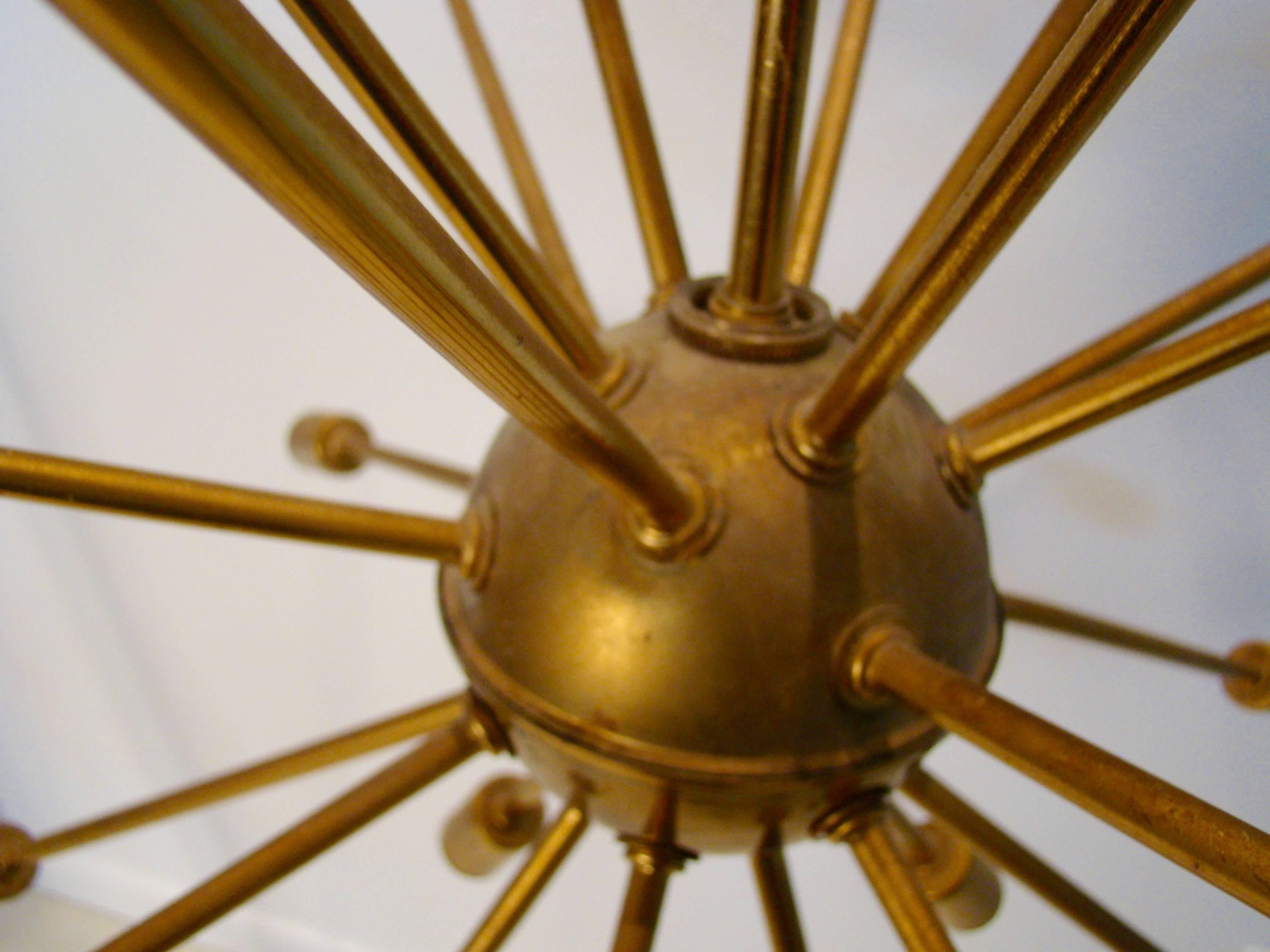 Beautiful brass Sputnik light fixture aged with a warm patina.

Measures: 24