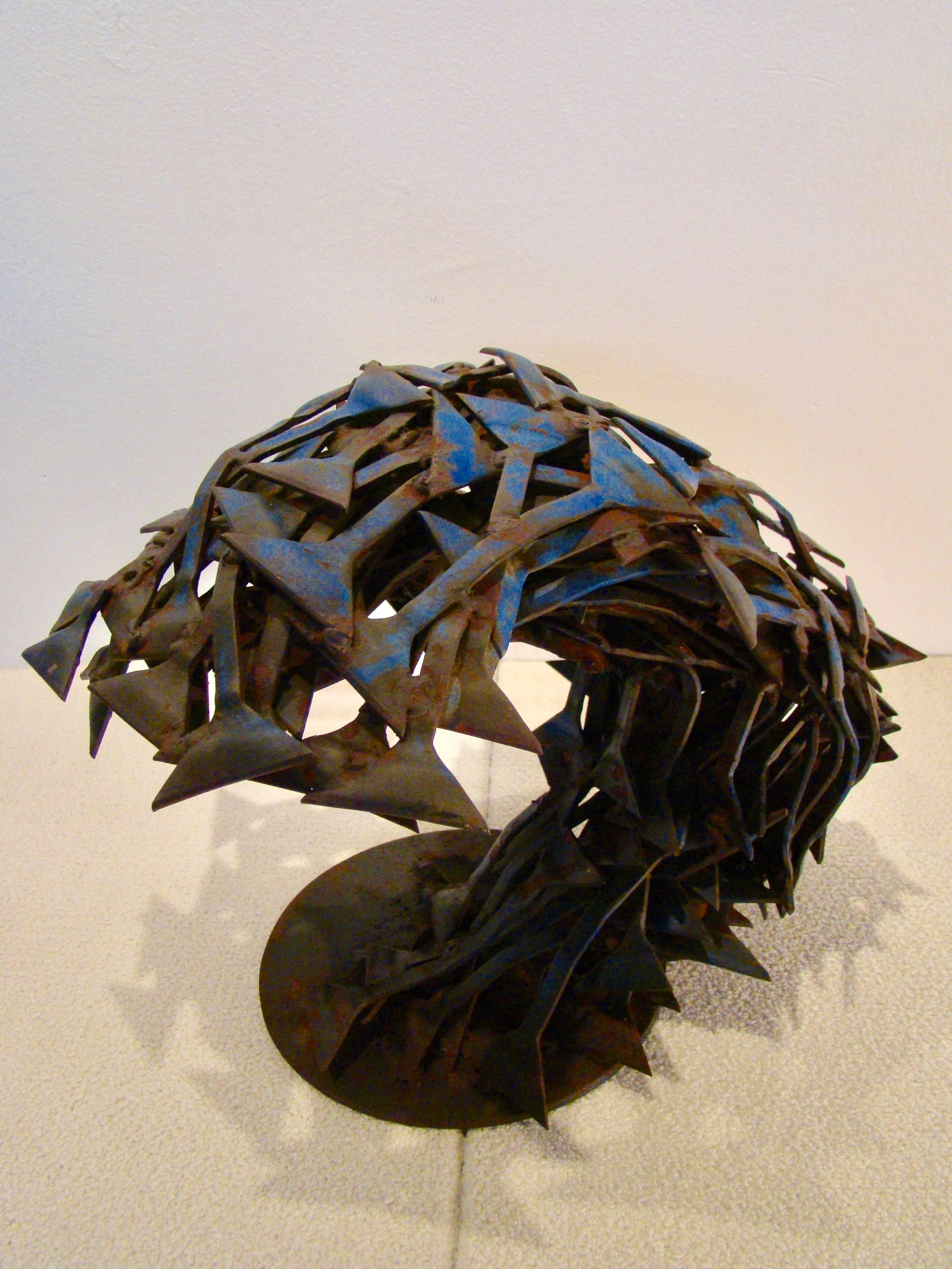 Brutalist abstract sculpture that resembles a roaring sea urchin, circa 1990s.