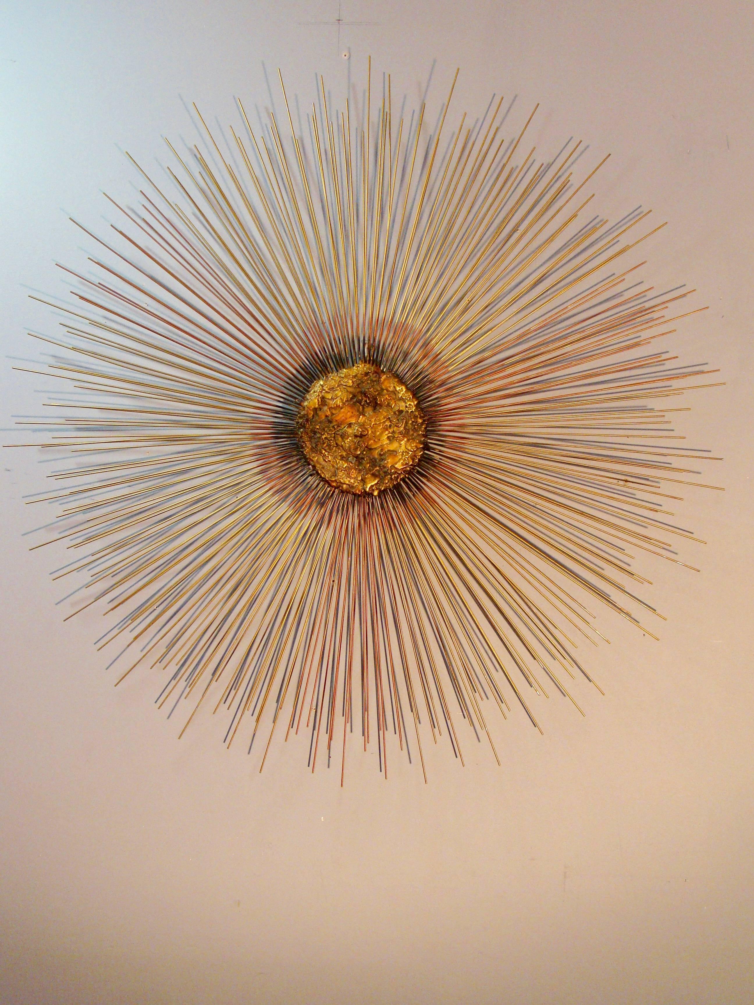 Brutalist mixed metals sunburst sculpture attributed to Curtis Jere. Solid and heavy, the sculpture depicts depth and movement and will enhance any room.

Measures: Depth of the sculpture is 3.5.