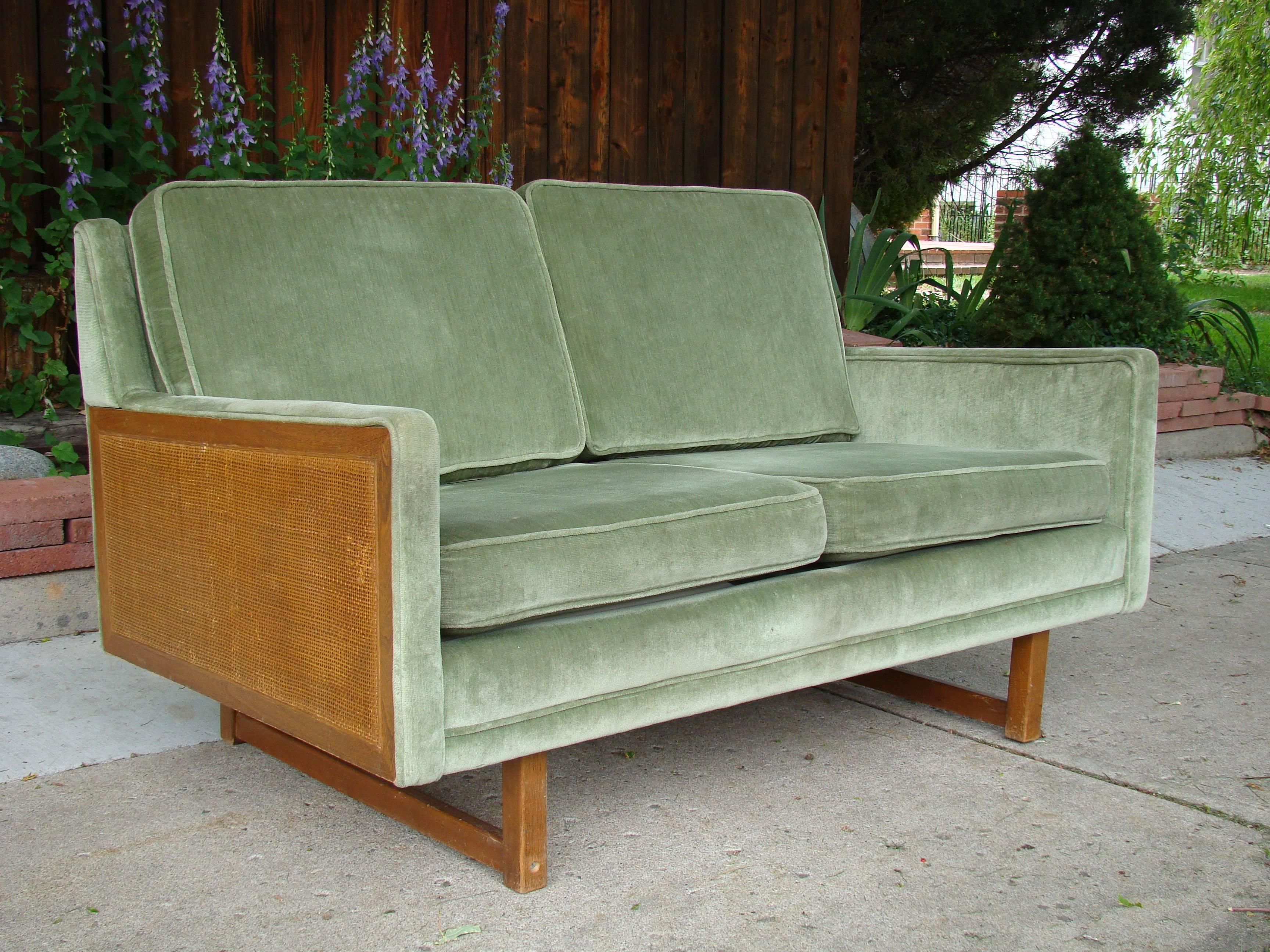 Beautiful celery green loveseat in the style of Peter Hvidt. Perfect for those smaller spaces.