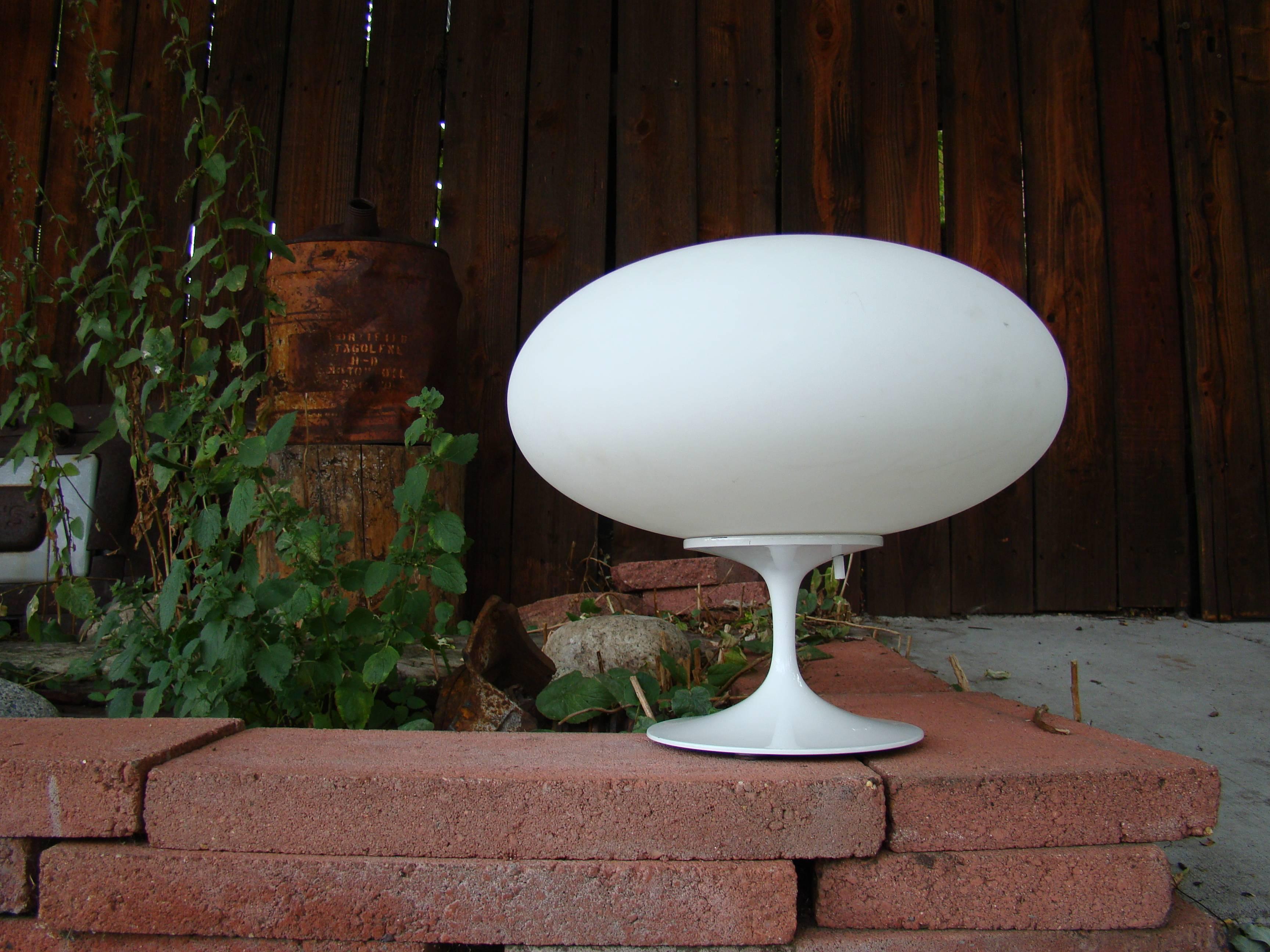 Beautiful white enamel 'tulip style' Metal base with original matte frosted, blown glass diffuser. Three position switch to 'Fine tune' your lighting. Hard to find, 1960s vintage lamp in very nice condition. Wonderful illuminated light form.