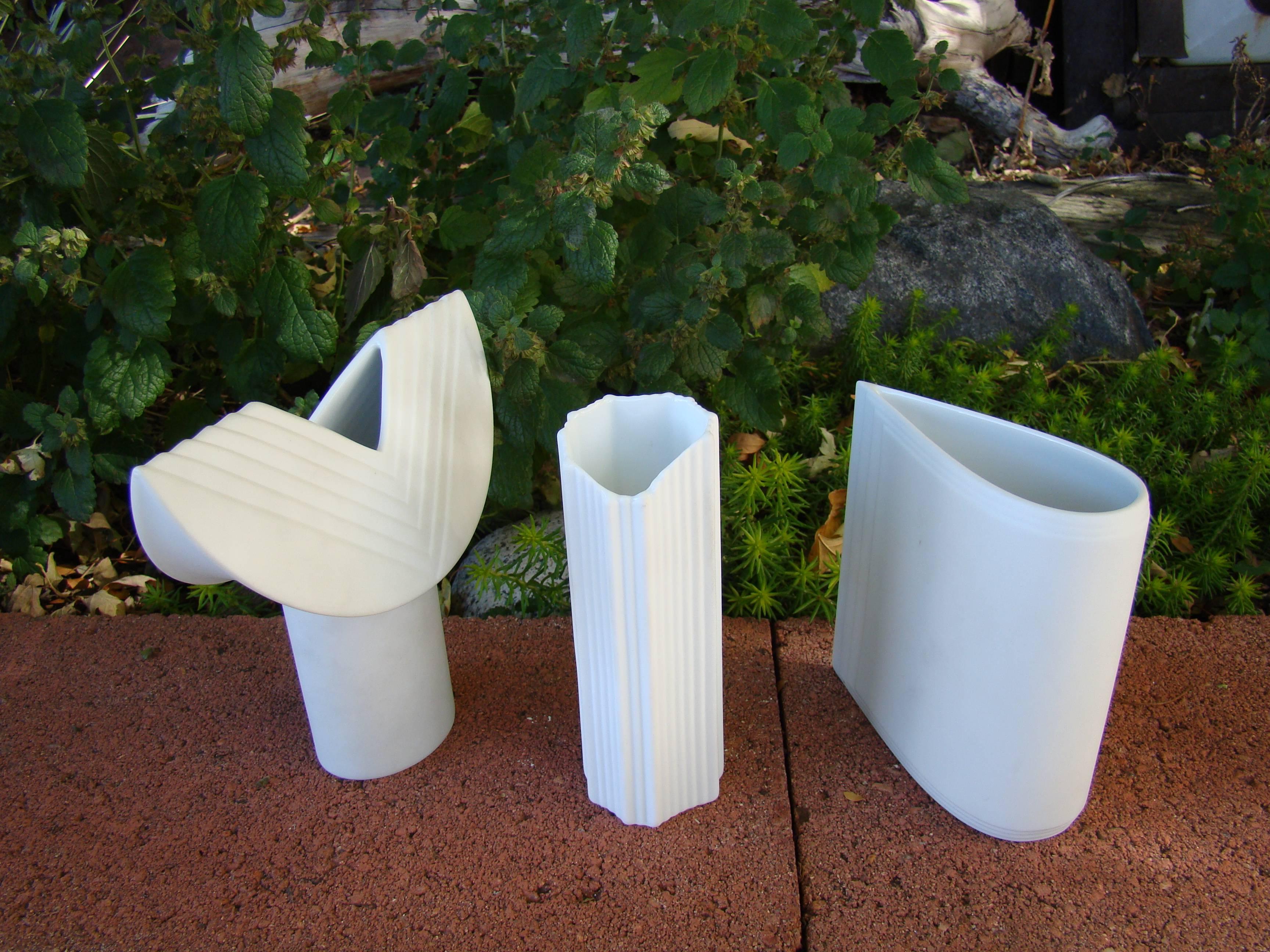 Group of three German ceramic bud vases consisting of two vintage (signed) studio Rosenthal vases in bisque and one Nitzsche ceramic porcelain bud vase, also in bisque. Unmatched detail. Taller vase (Rosenthal Ambrogio Pozzi 'TOTEM') is 6