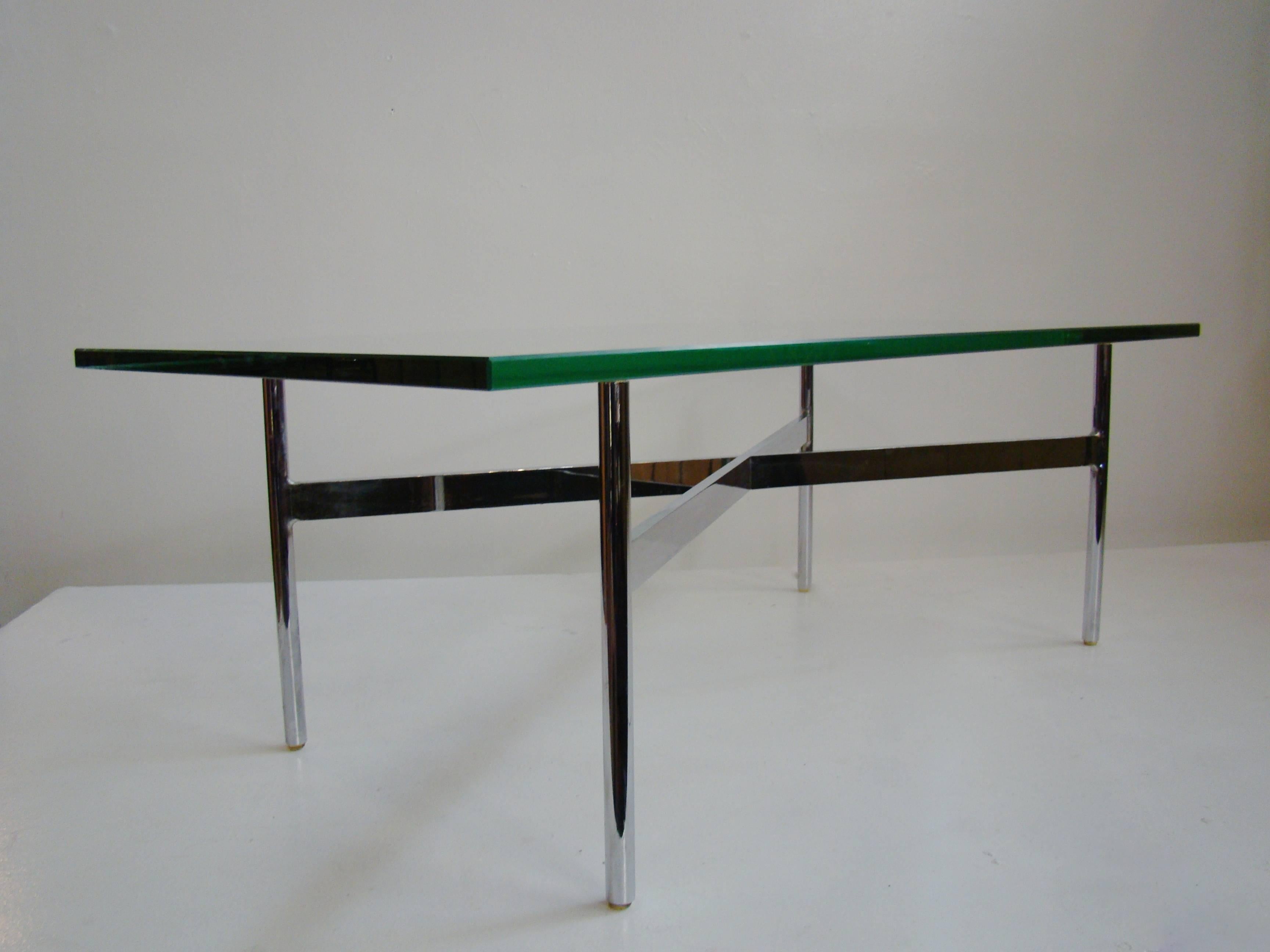Stunning, simple design (the "New York" series, circa 1962) with perfect proportions executed in solid chrome plated bar steel and original chartreuse polished edge plate glass top.

The table is being offered with the original glass