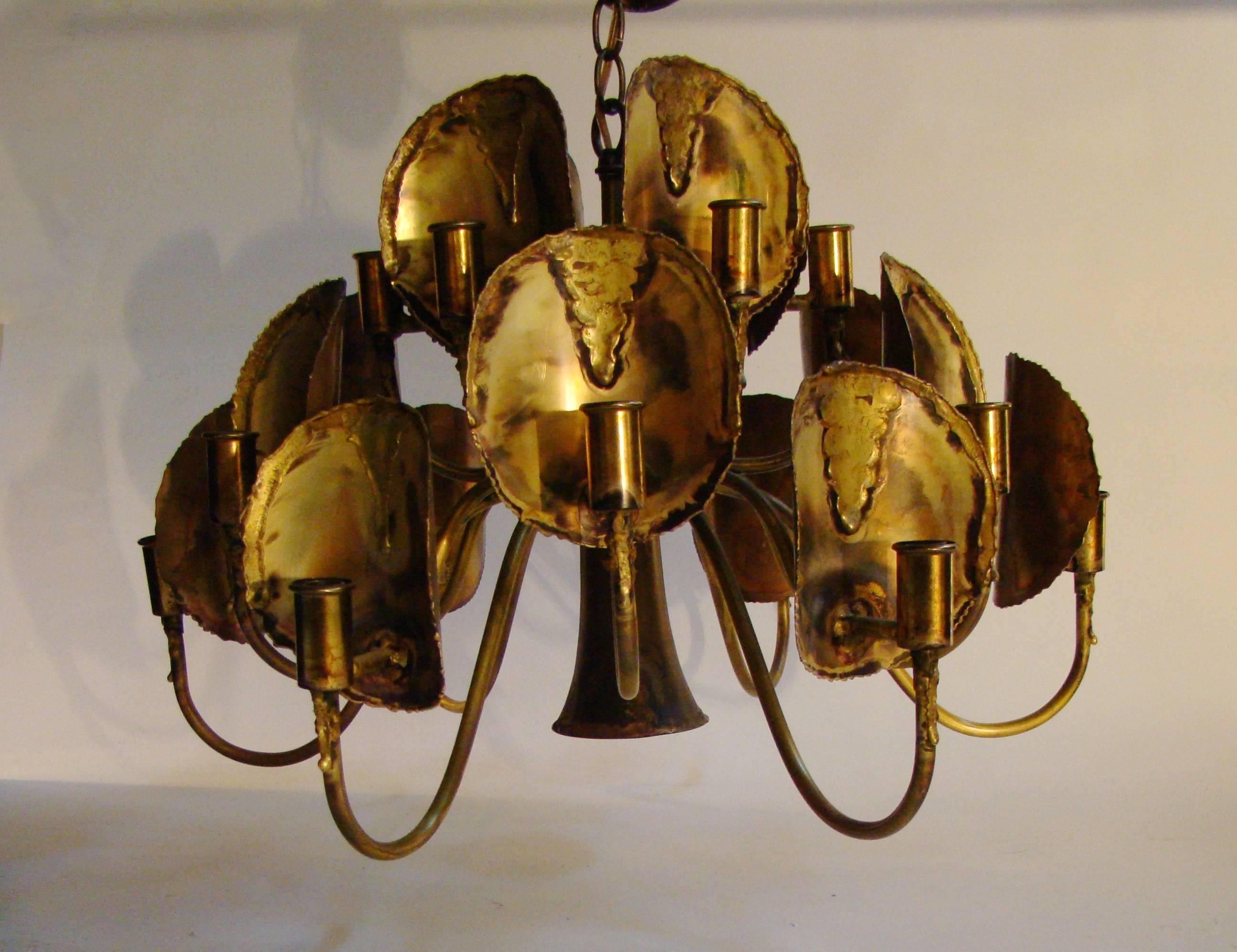 Exquisite mixed metals brutalist chandelier by Tom Green for the Feldman Co. C. 1970s.  Has 18 sockets for bulbs and 1 down light.