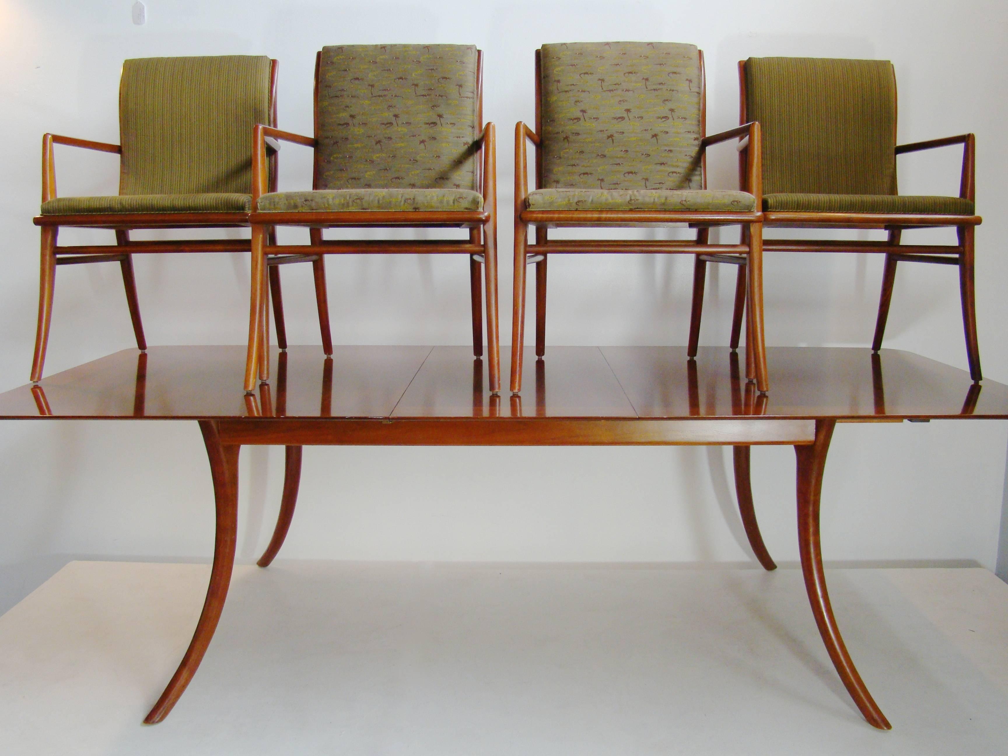 Incredible Gibbings dining room set with ten chairs and table, circa 1950. The set includes the dining table with two leaves, six side chairs, and four armchairs. The table is in a separate listing as are the four armchairs and six side chairs.