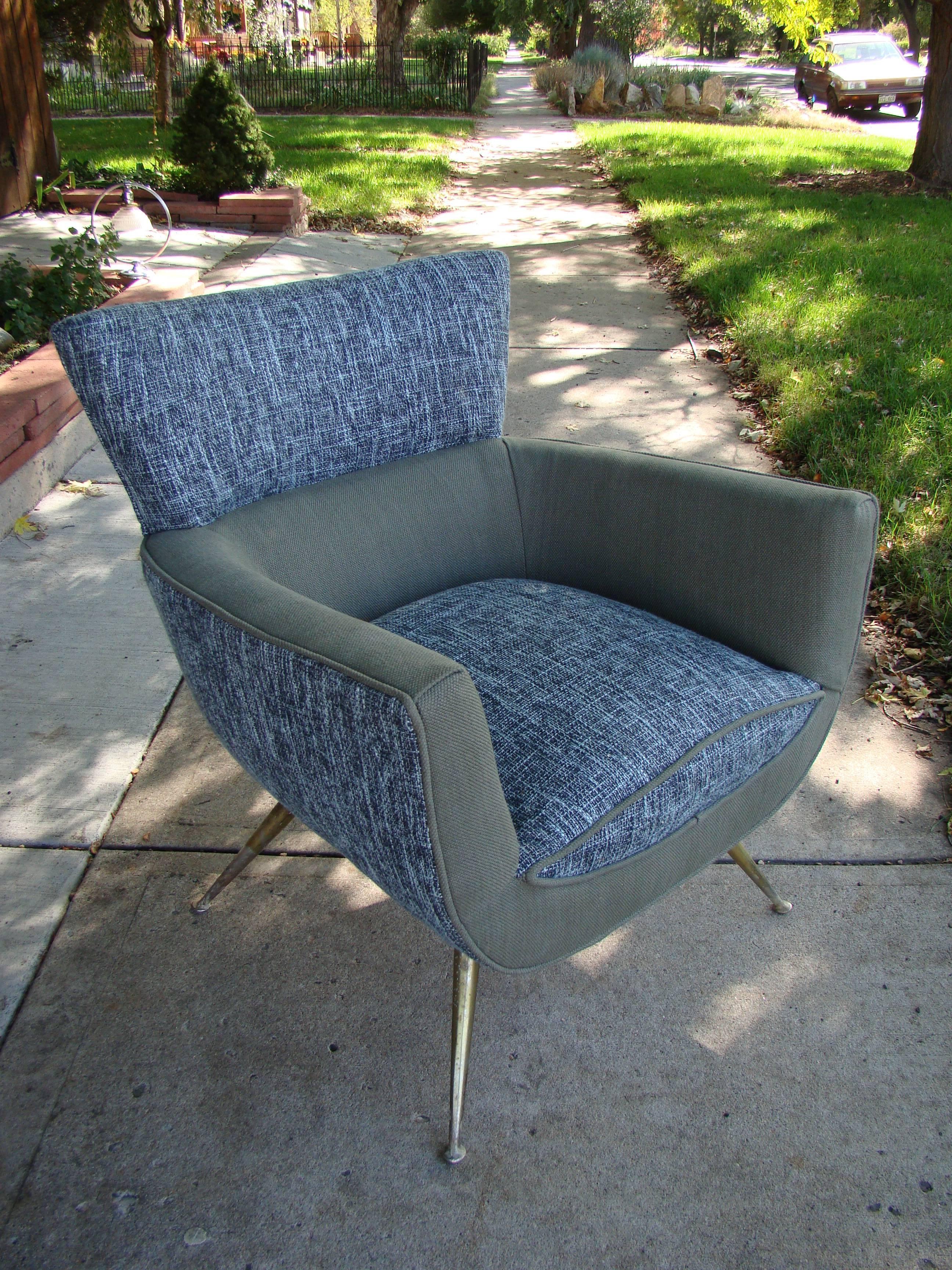 Unattributable, but undeniably Classic, early 1950s Italian design with dramatic tapered brass finish metal legs.
Recent upholstery in two tones, a beautiful crosshatch blue/white tweed and solid khaki/fatigue green tight tweed.
Lacquered brass