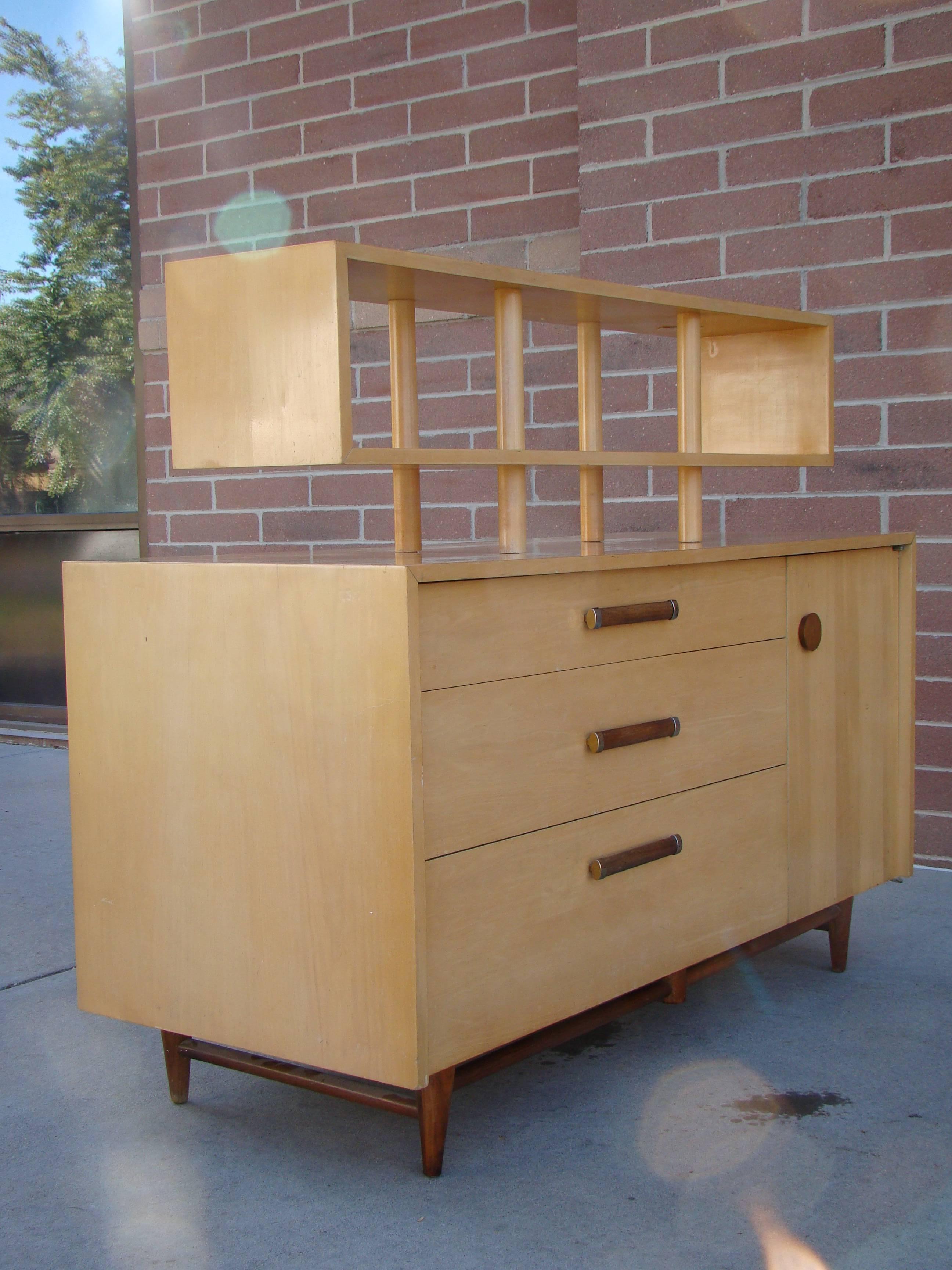 Beautiful and modern unique double sided cabinet designed by Merton Gershun for American of Martinsville Urban Suburban line, circa 1950s. A very versatile piece in that either side can be used. One side features three drawers and a door and the