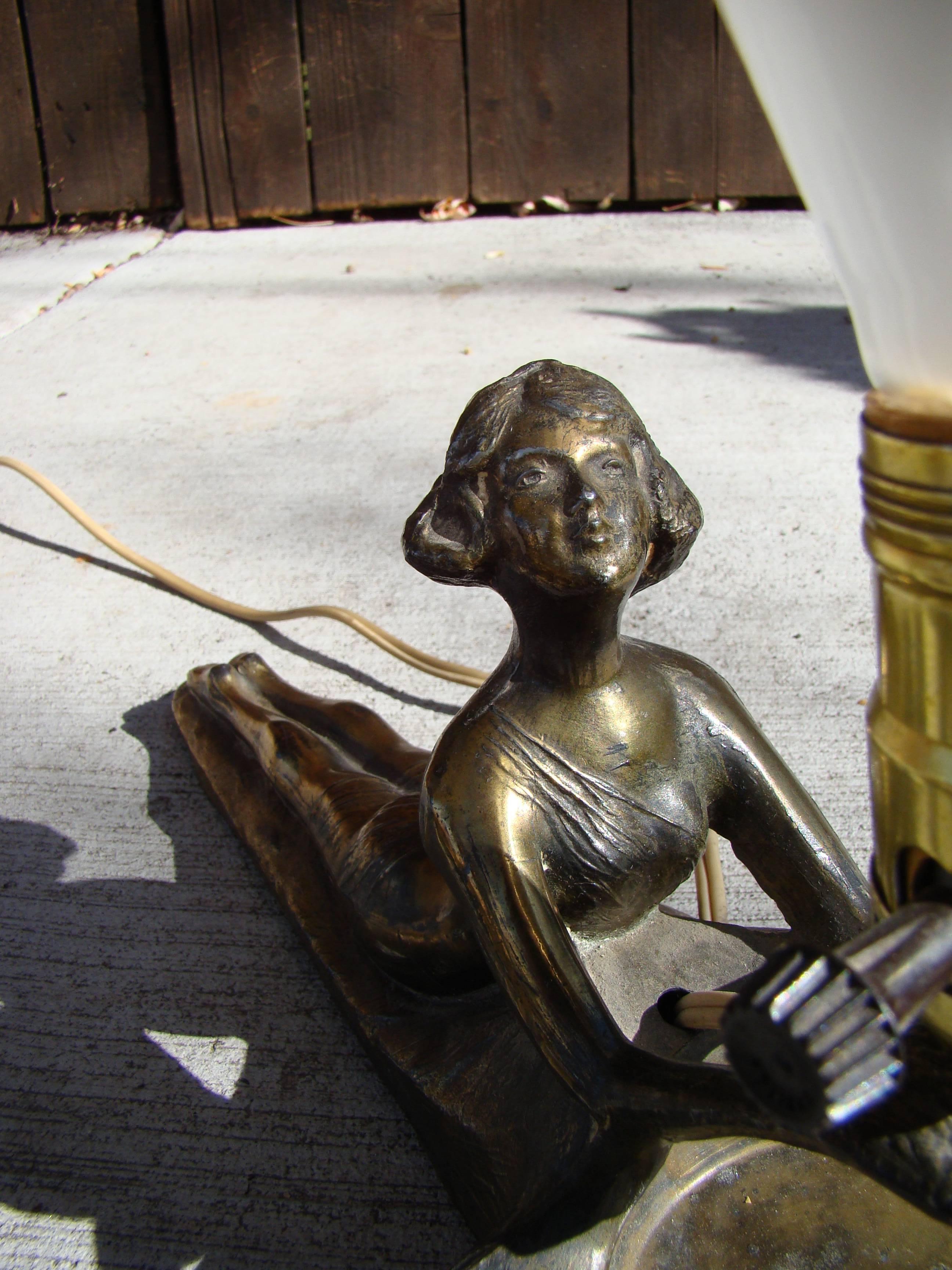 Beautiful Art Deco bronzed metal nude tabletop radio lamp with catch all. Looks to be original shade.