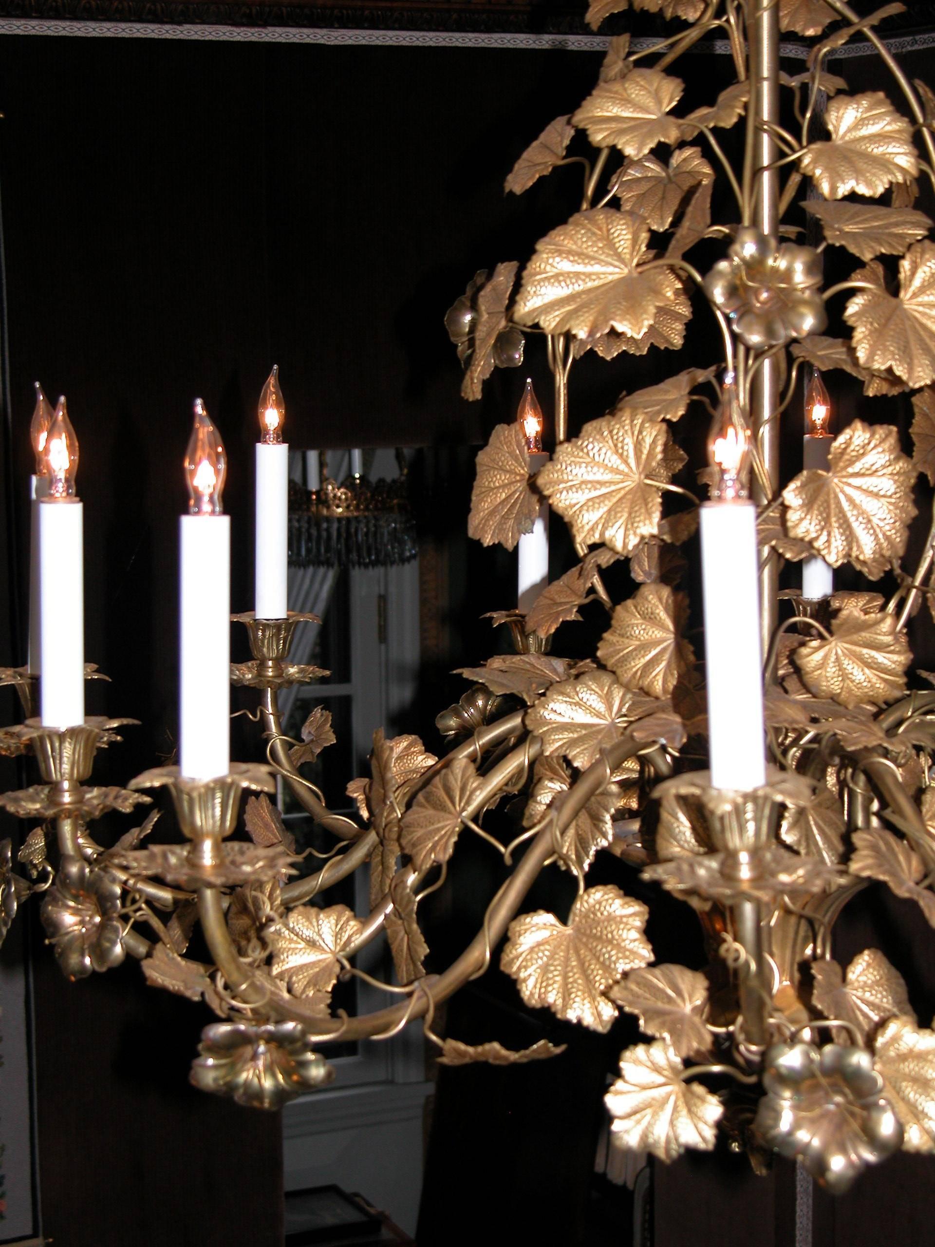 Stunning twelve-light, French or English chandelier in a design of Nasturtium flowers and leaves in stamped gilded brass. Nasturtium flowers instead of lilies, grapes and wheat are almost unheard of. In 57 years of business we have never seem one