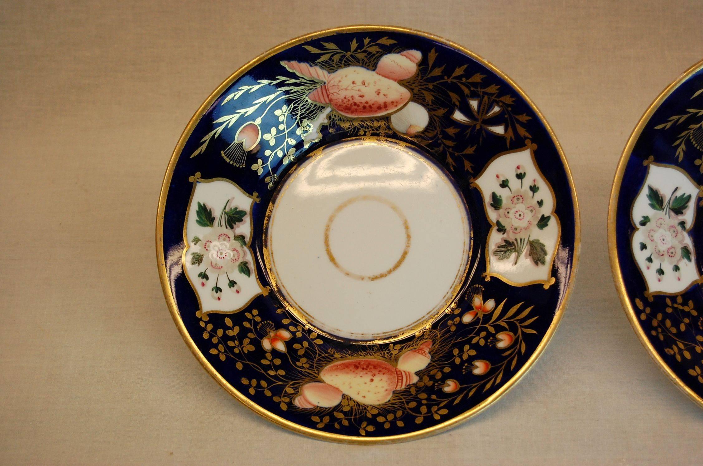 Pair of mint condition plates, possibly Spode, mid-19th century. Seashell and floral designs on cobalt blue background.