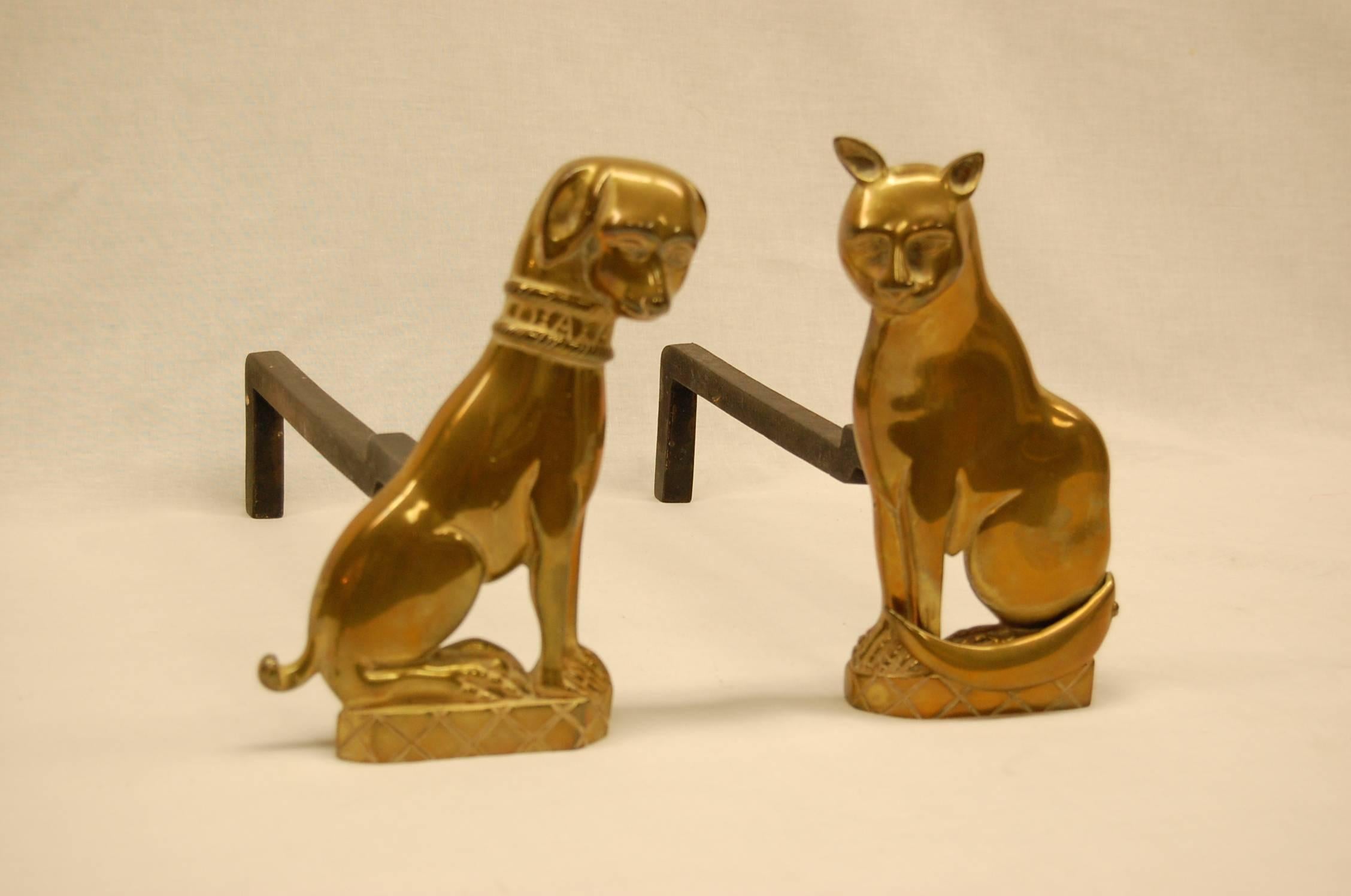 Pair of andirons in excellent condition, solid brass in an older lacquered finish.