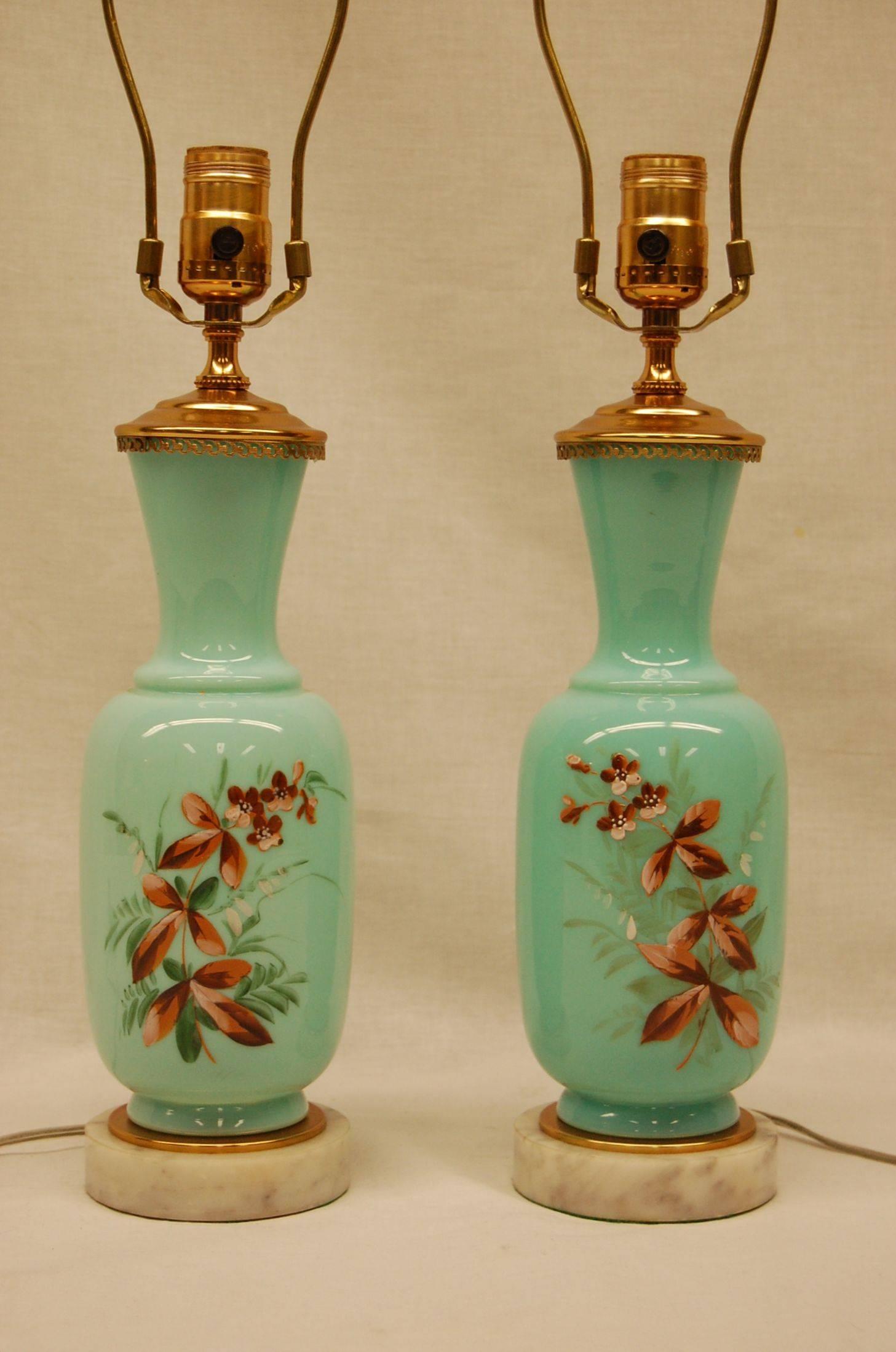 Pretty dressing table lamps in a light mint green color with hand-painted floral scenes on white marble and brass bases. Perfect mint condition. It is 11 1/2