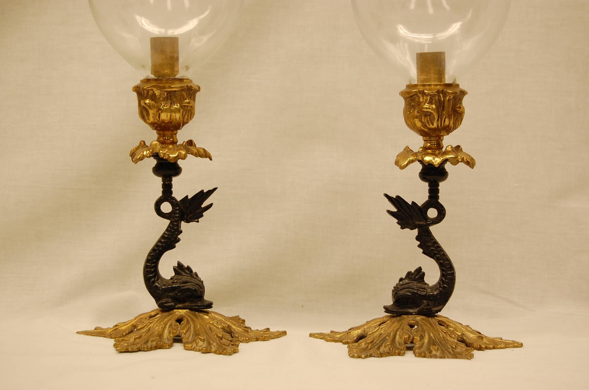 Unknown Pair of Reproduction Brass Candlesticks with Glass Hurricanes on Dolphin Bases
