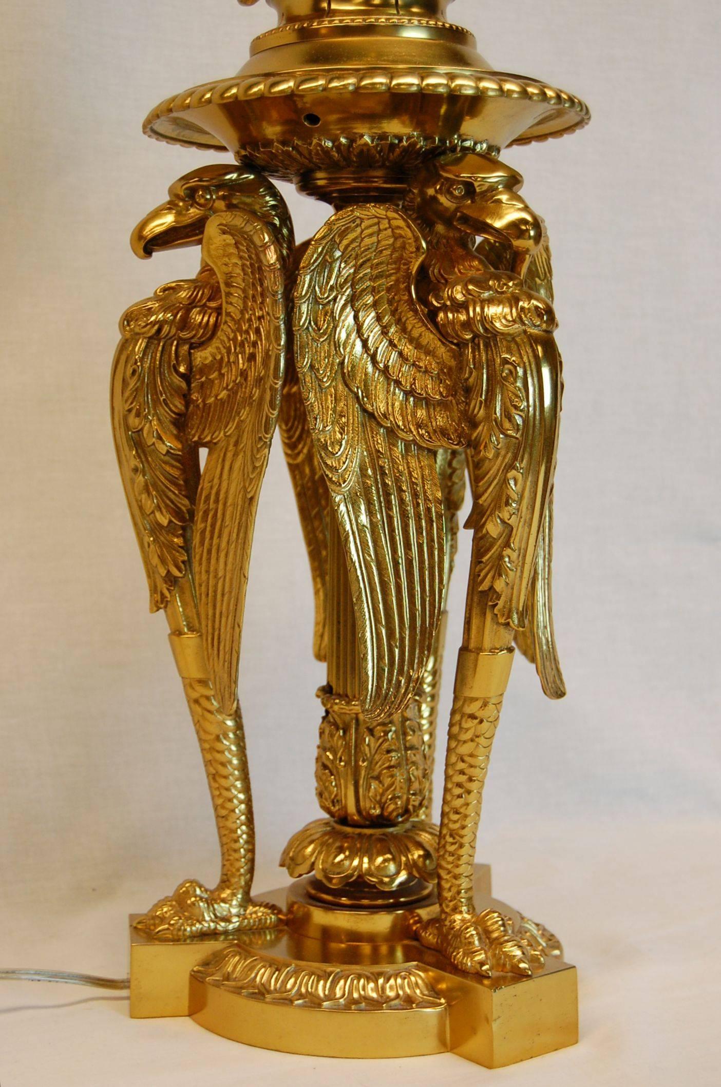 Empire Revival Large Gilt Brass Table Lamp Featuring Three Large Eagles For Sale