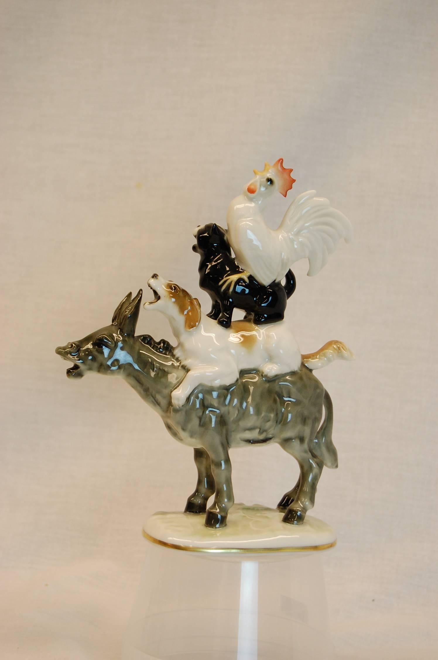 Perfect example of this porcelain figure of stacked animals riding a donkey.