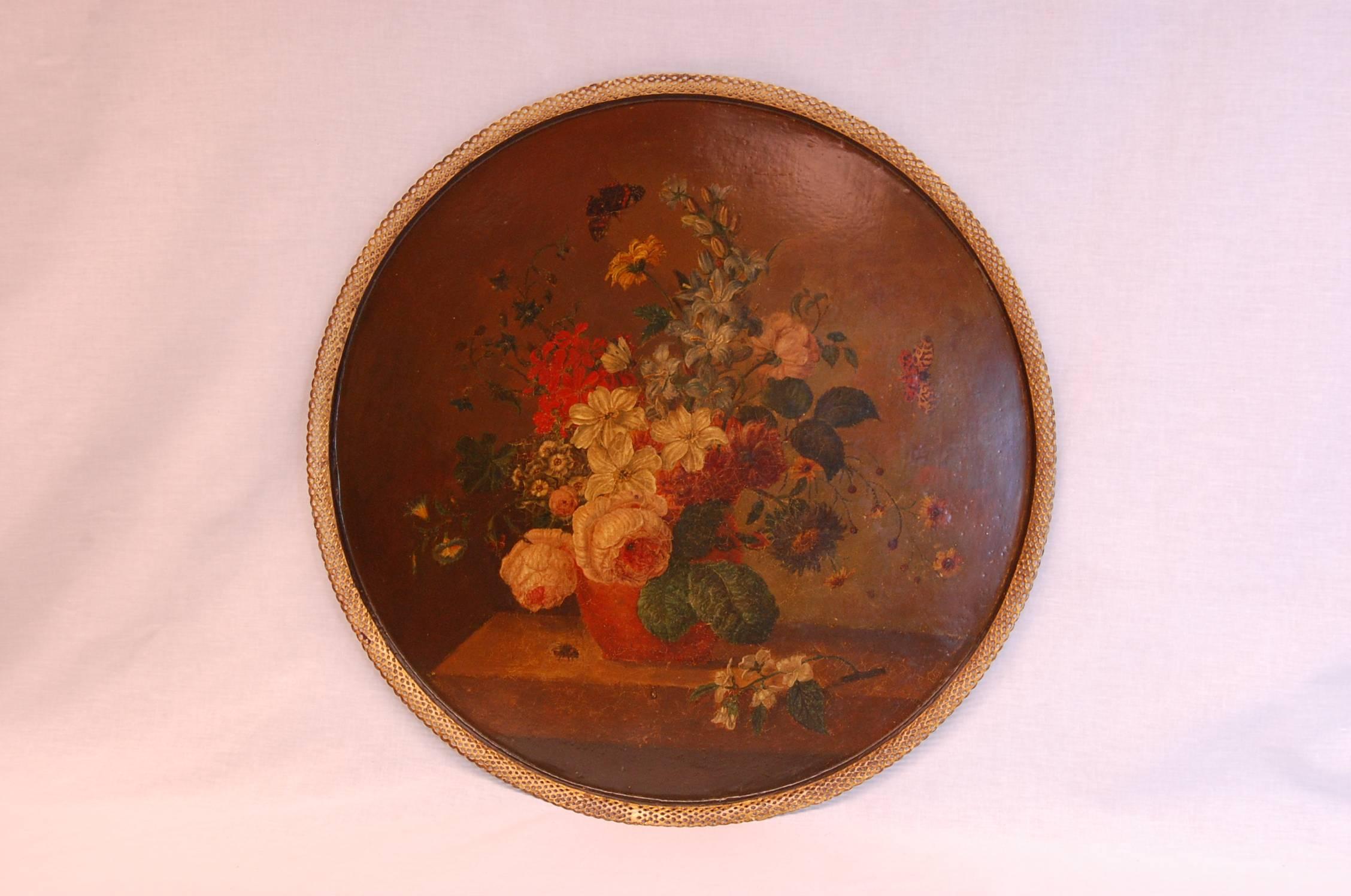 Large tole tray with pierced gallery edge and original floral painted decoration. The black painted is base is newer and in excellent condition.