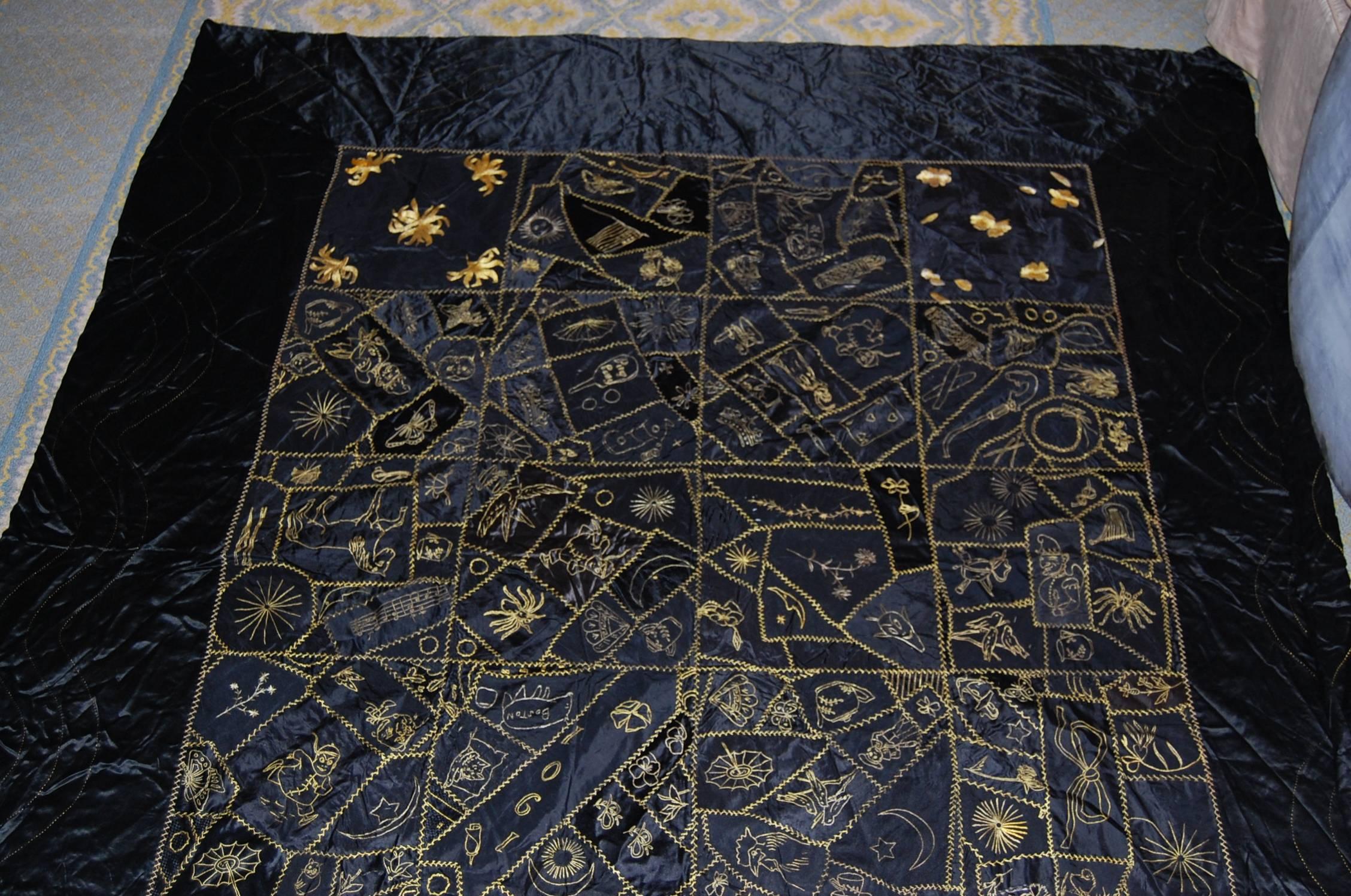 Fantastic quilt all done in gold threads on black silk, dated 1901, Boston. There are many different depictions of children, animals, etc., measures: 80" x 93".