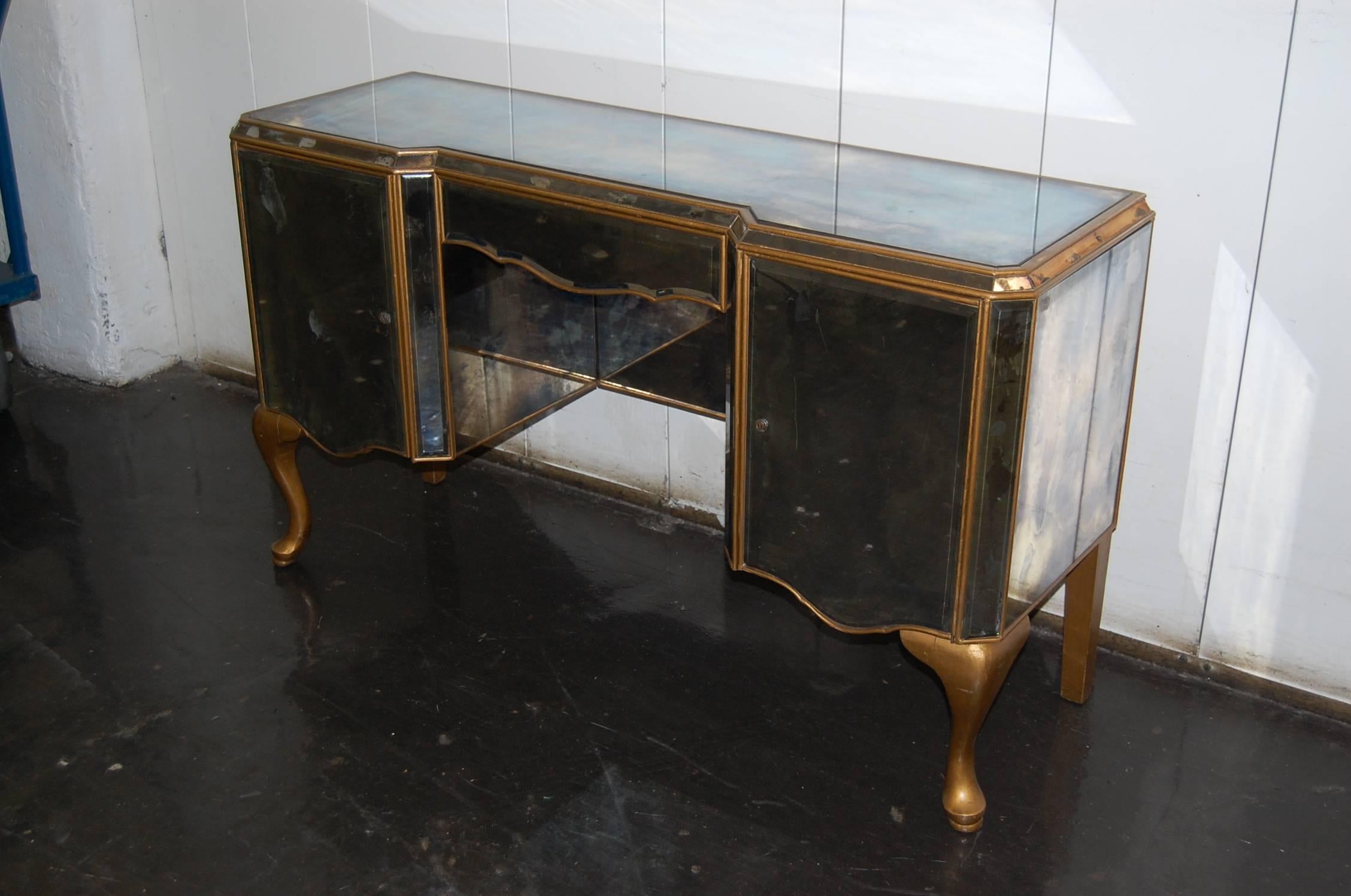 Very well built Mid-Century dressing table with marbled mirror, in good condition. Two doors and one drawer, no keys. No breaks or missing glass.