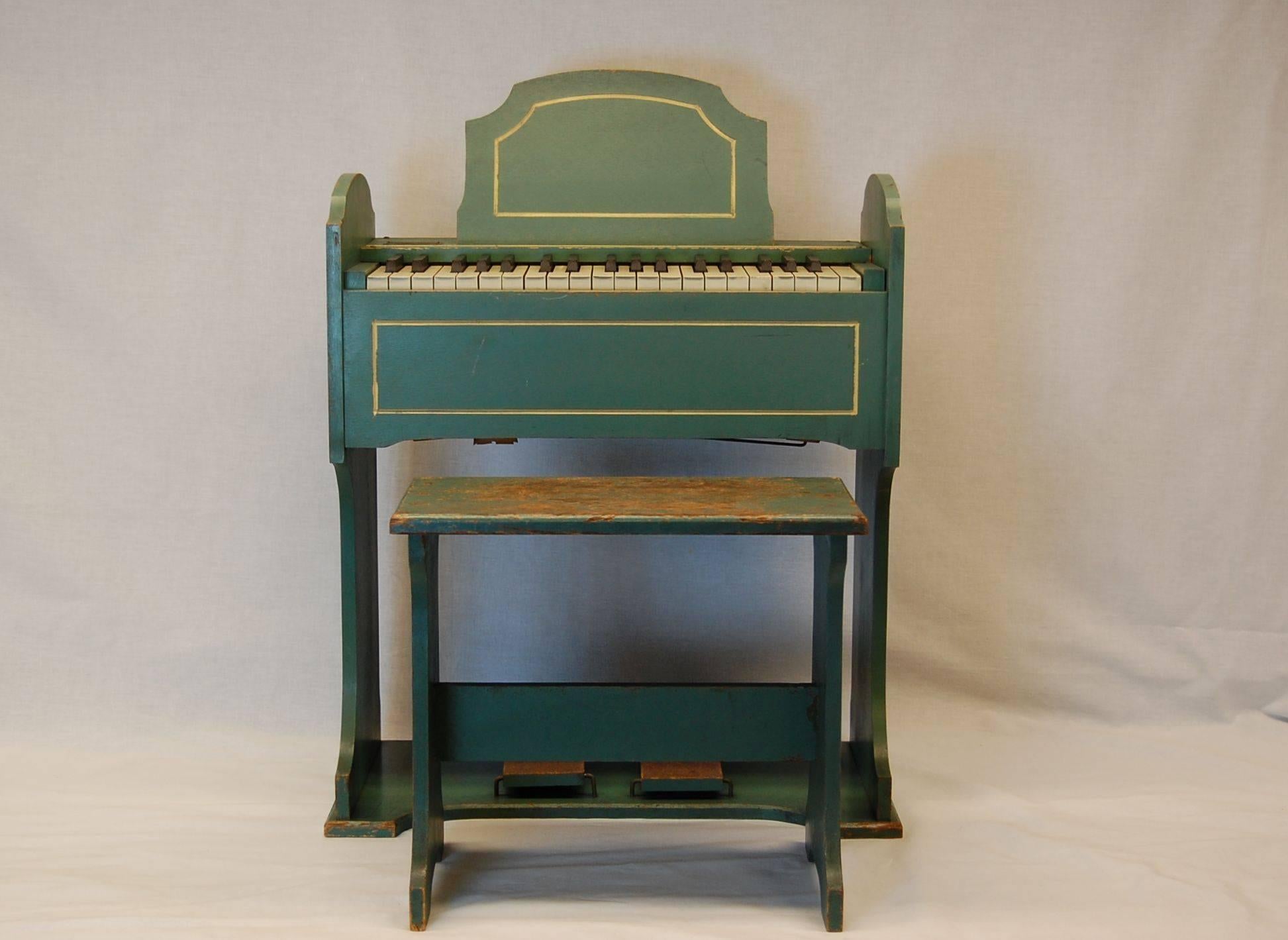 Wonderful child's organ circa the late 1930s or early 1940s, good overall condition. Comes with the original stool and easel. In the 1930s and 1940s, Estey developed a line of pint-sized, foot-pumped, miniature “children’s organs” for small players.