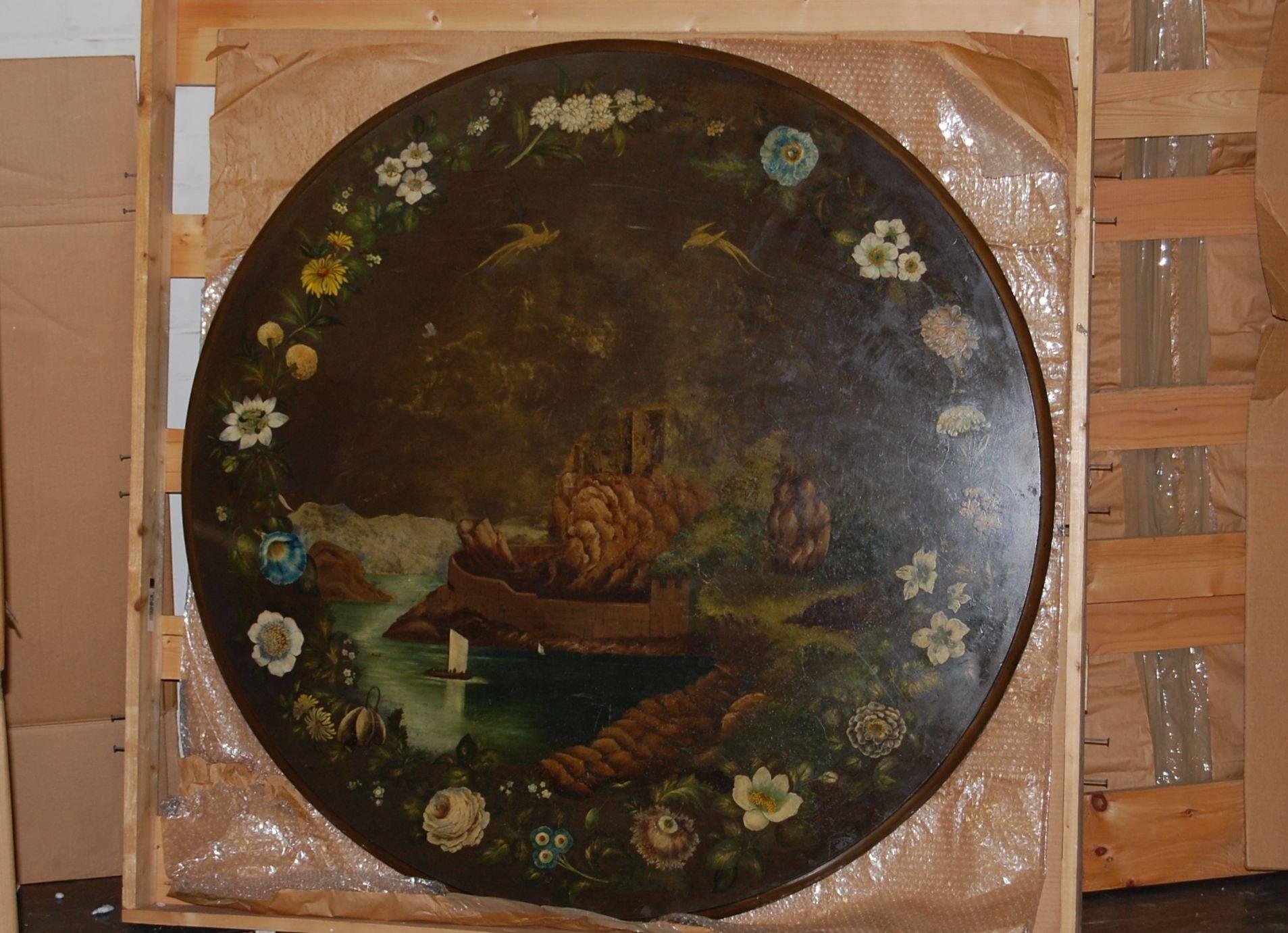 Mahogany triangular base with three columns supporting a slate painted top, the border around the top features flowers, the center section features a lake, castle, birds, etc.