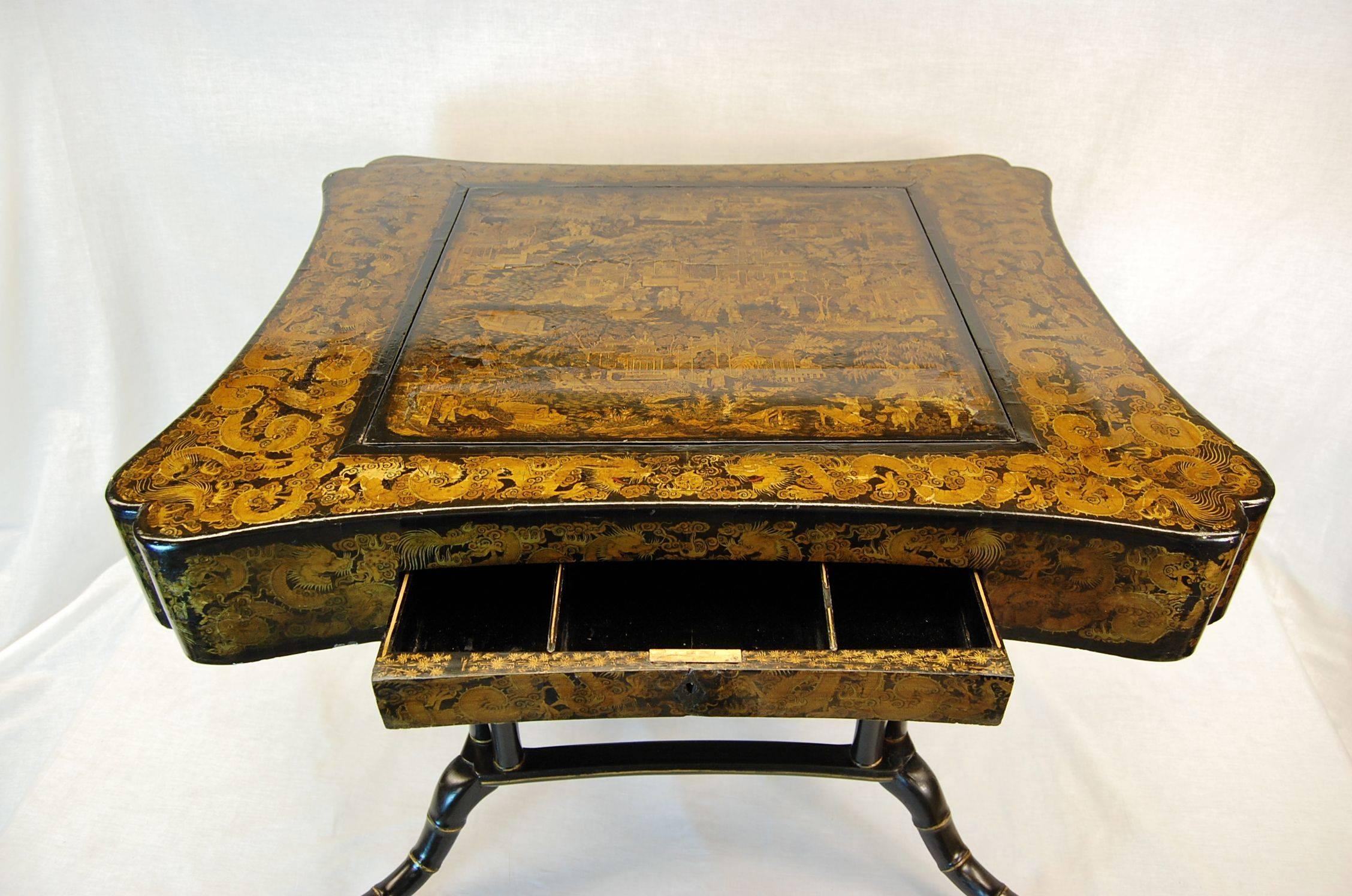Rectangular Japanese decorated games table with reversible top, the checker board is inlaid with mother of pearl. The faux bamboo black painted and gold decorated base was added mid 20th century, the table originally had a pedestal base and may have