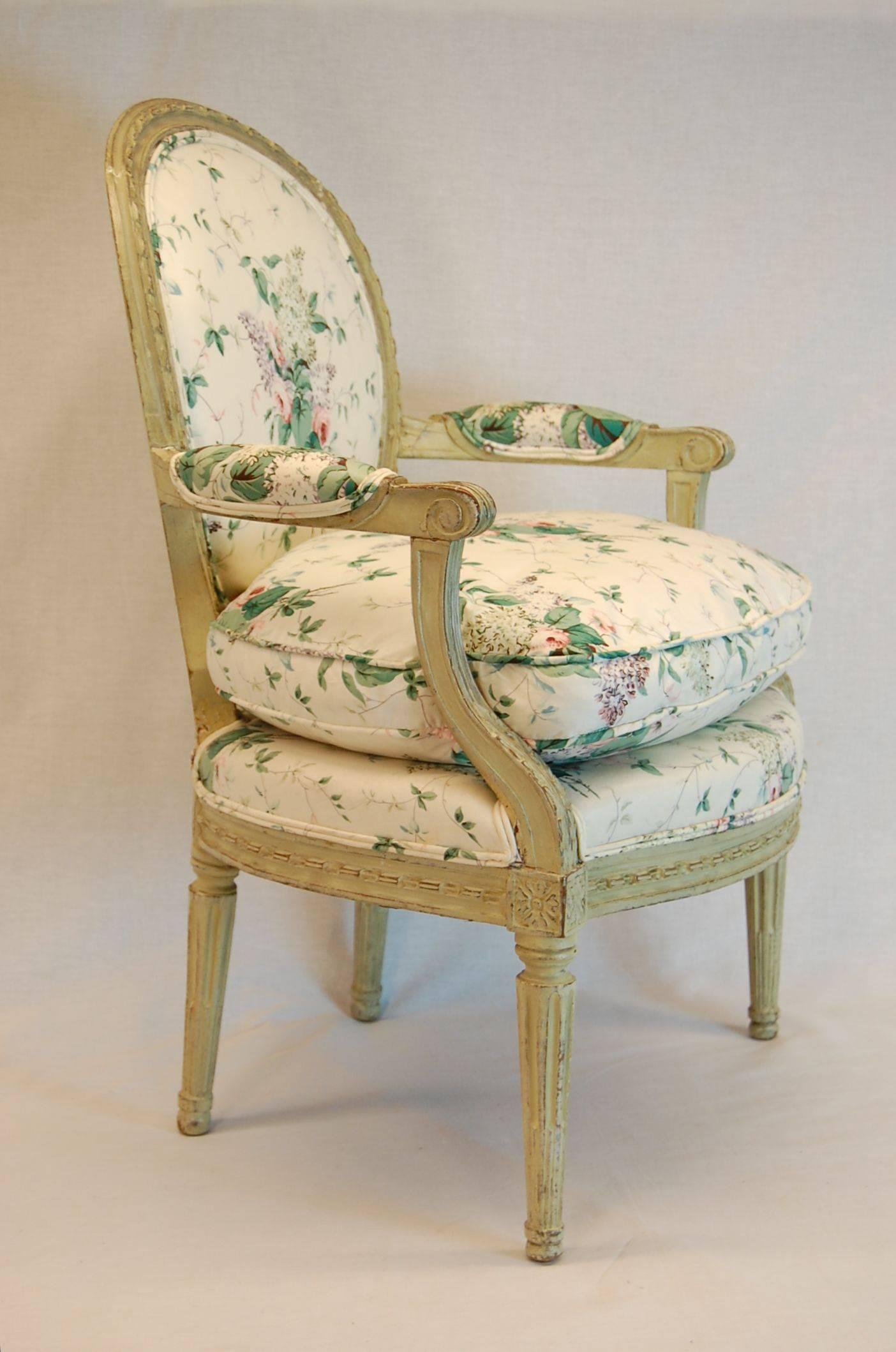 Louis XVI carved wood & hand pegged Fauteuil in original green painted finish, currently covered in printed cotton chintz. Very nice carved ribbon details around the back and apron as well as carved Acanthus leaves along the front of the arm.