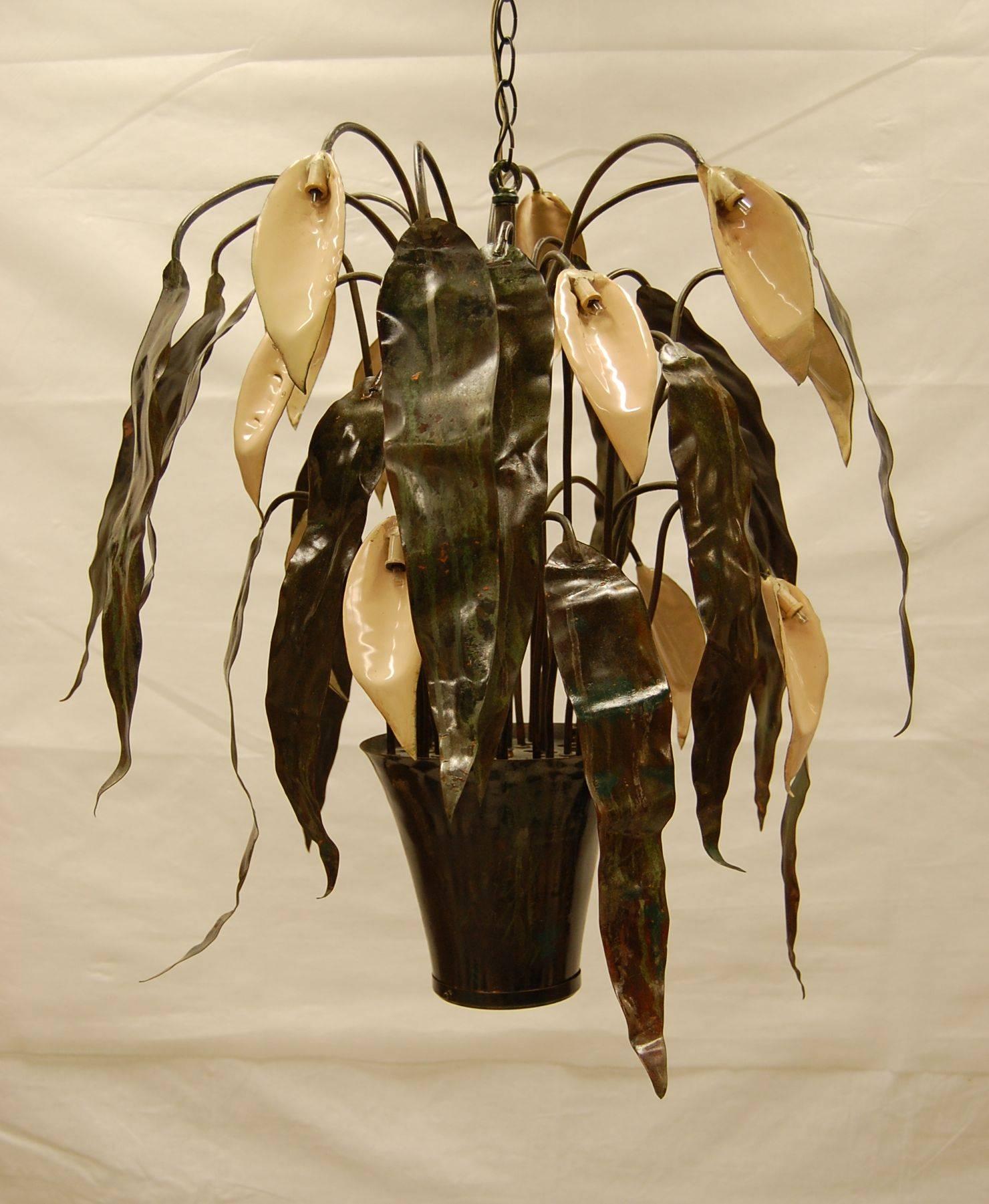 This is an original copper enameled chandelier made in the 1960s by the late Garland Faulkner of Miami Florida. It measures 24" in diameter and is 26" deep plus 12" of chain. There is also an internal down light that takes a standard