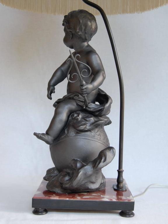 Lead Cherub Figure Wired as a Lamp on a Marble Base In Excellent Condition For Sale In Pittsburgh, PA