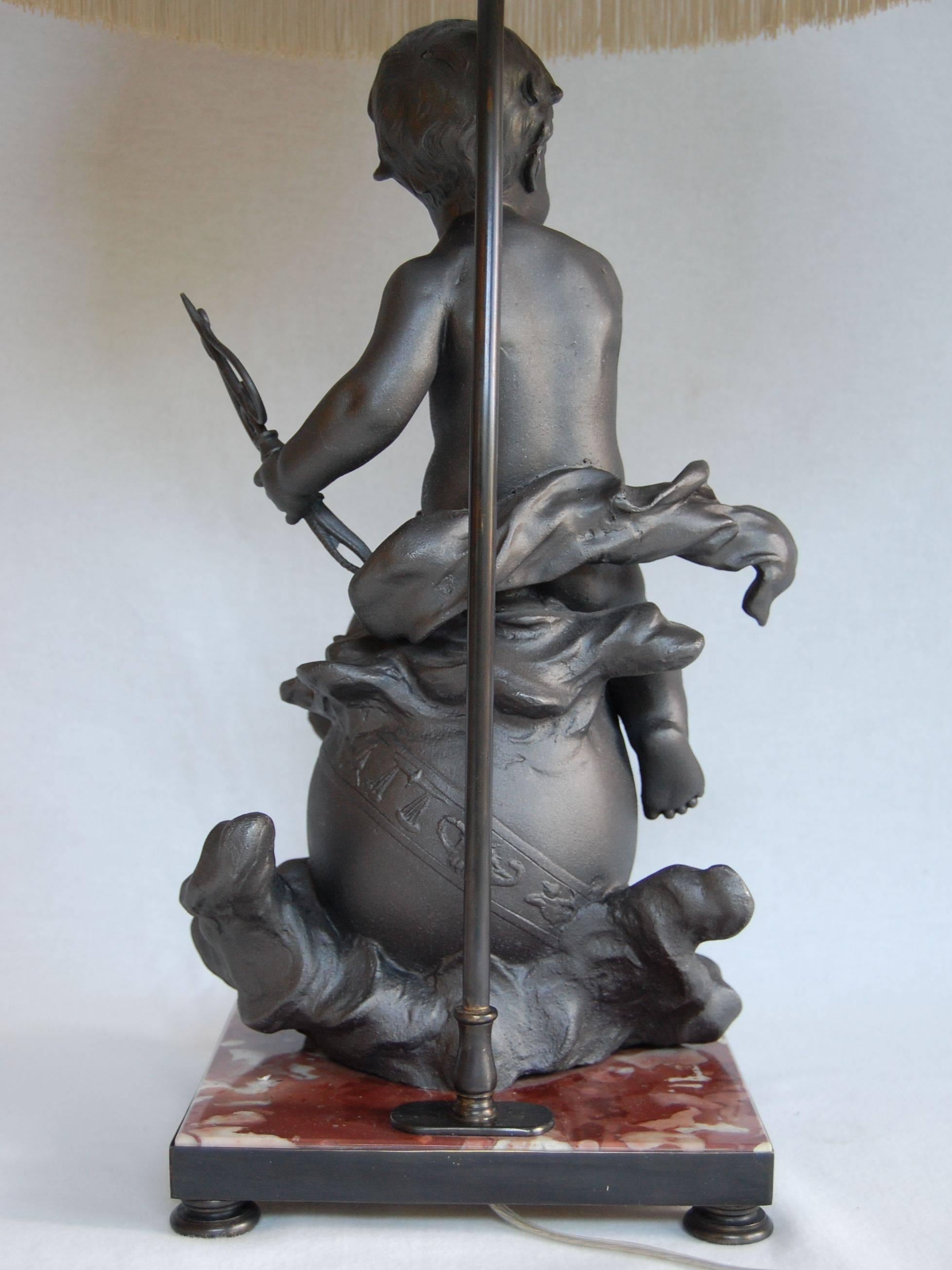 19th Century Lead Cherub Figure Wired as a Lamp on a Marble Base For Sale