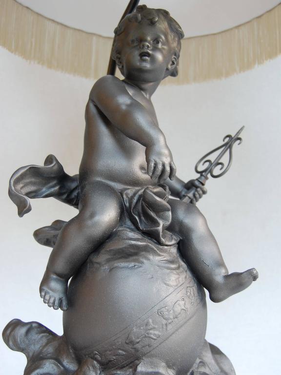 19th Century Lead Cherub Figure Wired as a Lamp on a Marble Base For Sale