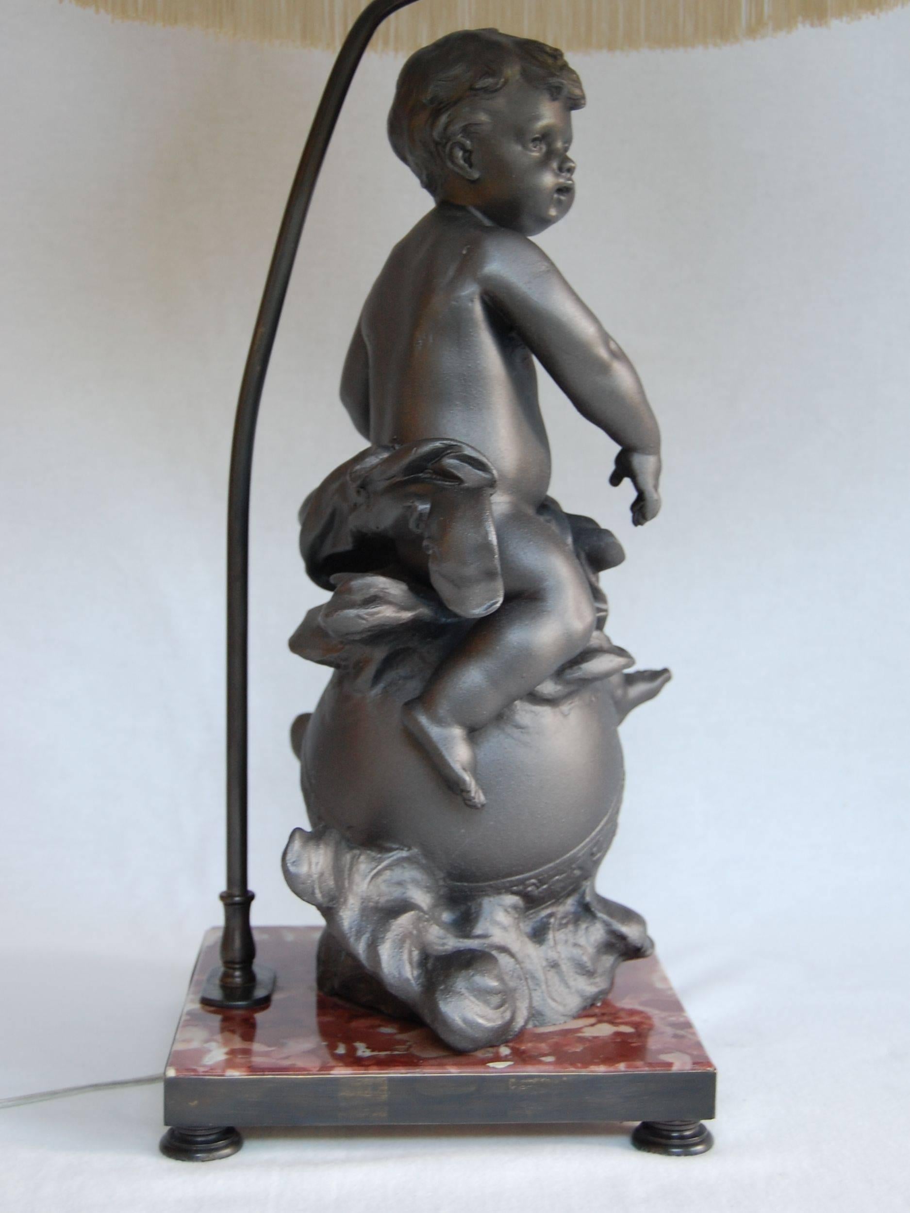Lead Cherub Figure Wired as a Lamp on a Marble Base For Sale 1