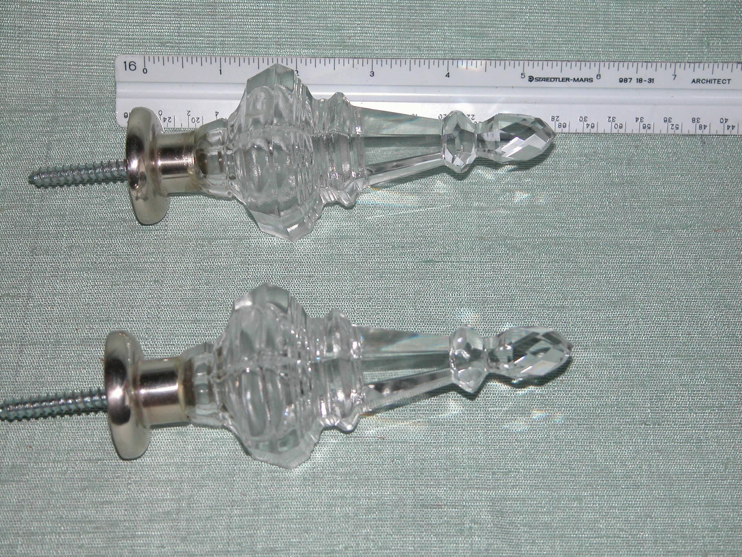 Pair of silver plated and clear Baccarat style glass finials for a drapery rod, 5.38 in length not including the threaded portion.