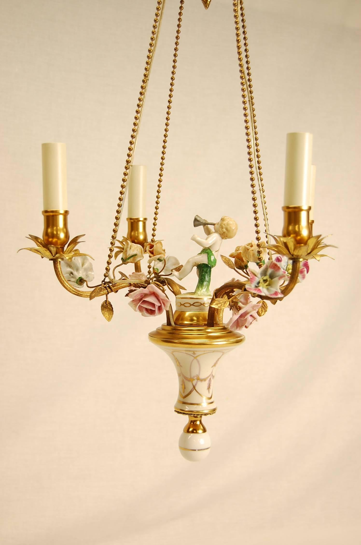 Pretty four-light chandelier with porcelain flowers and figure in excellent condition.