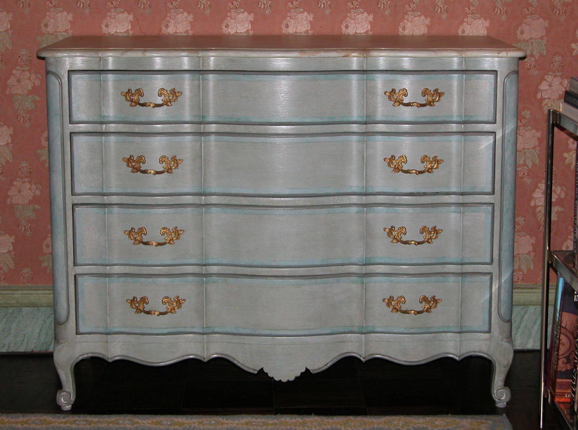 Louis XV style chest with four drawers, each lined in a white on white cotton stripe fabric. Excellent condition. A beautiful modeled blue finish with marbleized top.