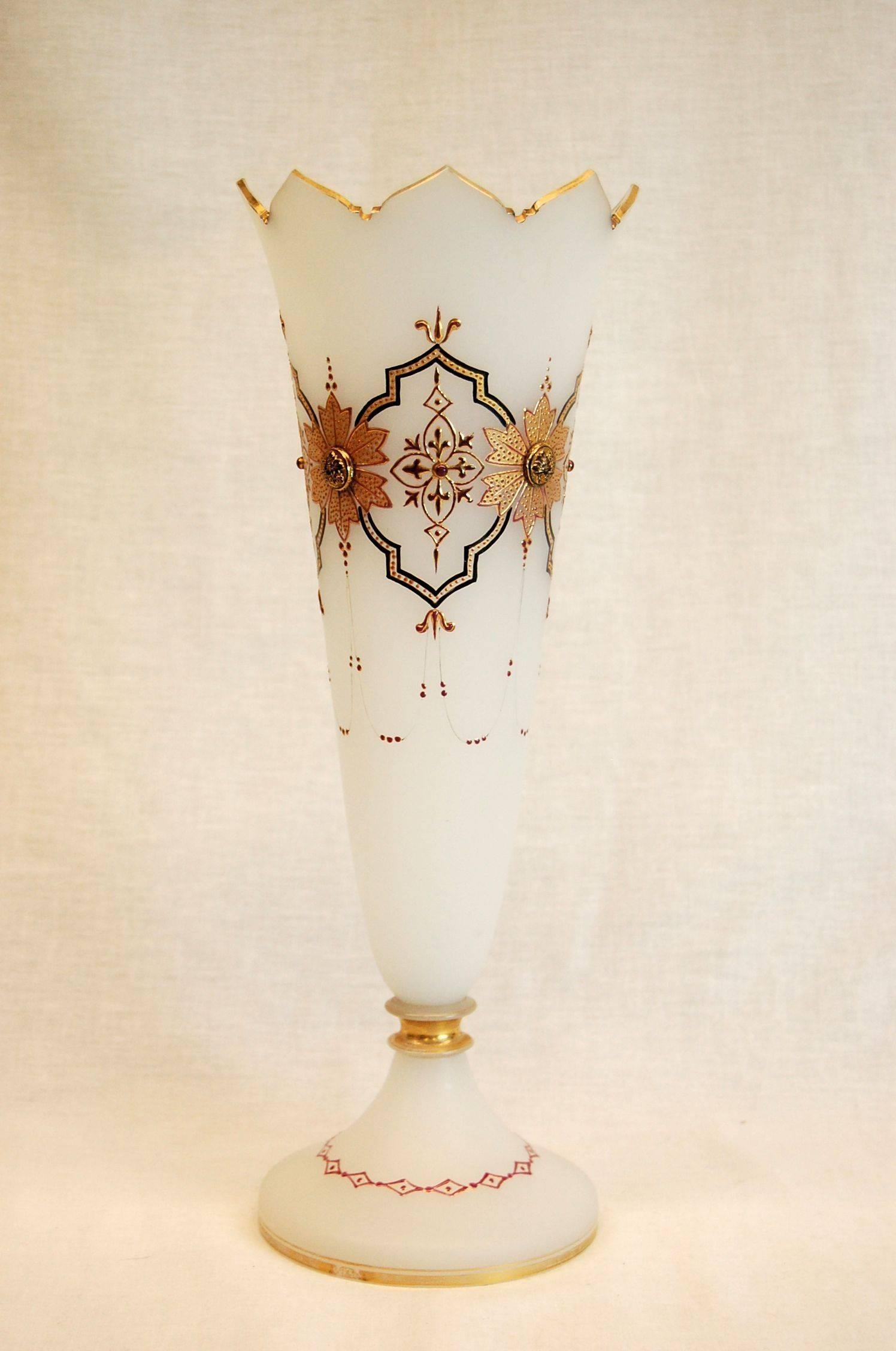 Tall vase with raised gold decorations in near mint condition. No chips or flaws in the glass, only the most minor gold loss on the bottom ring of the base.