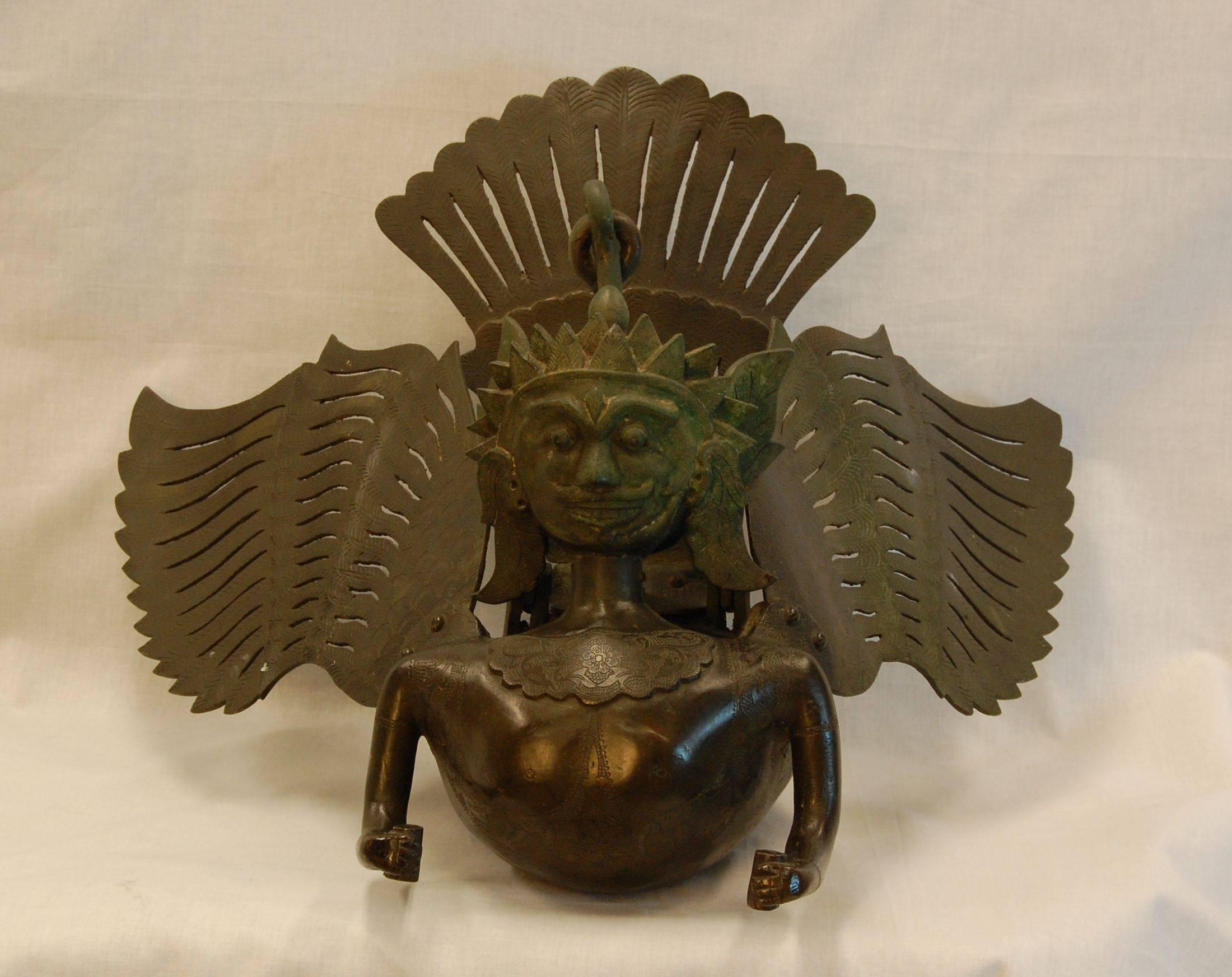 Large, heavy, hanging bronze incense burner in form of ancient Garuda figure. A very ornate and finely etched figure. Origin and exact age unknown. Purchased in 1962 from Madame Ray Paioss of Old Versaille Antiques in New York City.