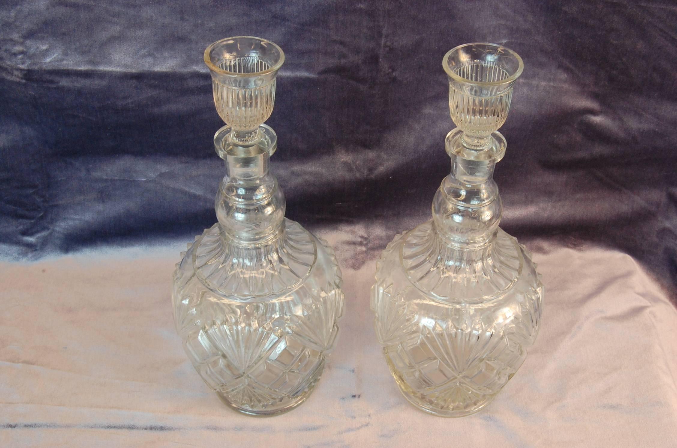 Pair of large clear glass bottles with the original stoppers, manufactured by Century Glass Co. The stoppers also double as a shot glass, a very rare type.