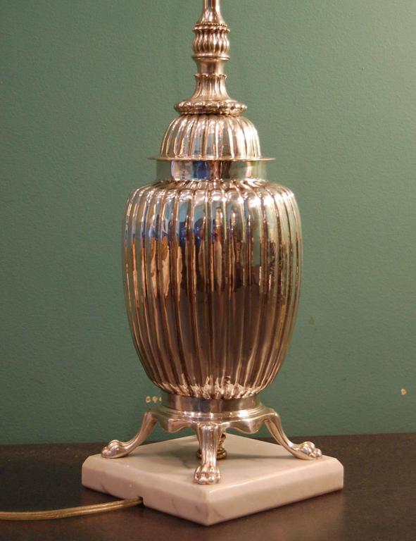 Silver plated tea caddie urn on marble base, just cleaned, polished and lacquered. New wiring with a three way socket. It is 15 inches to the bottom of the socket.