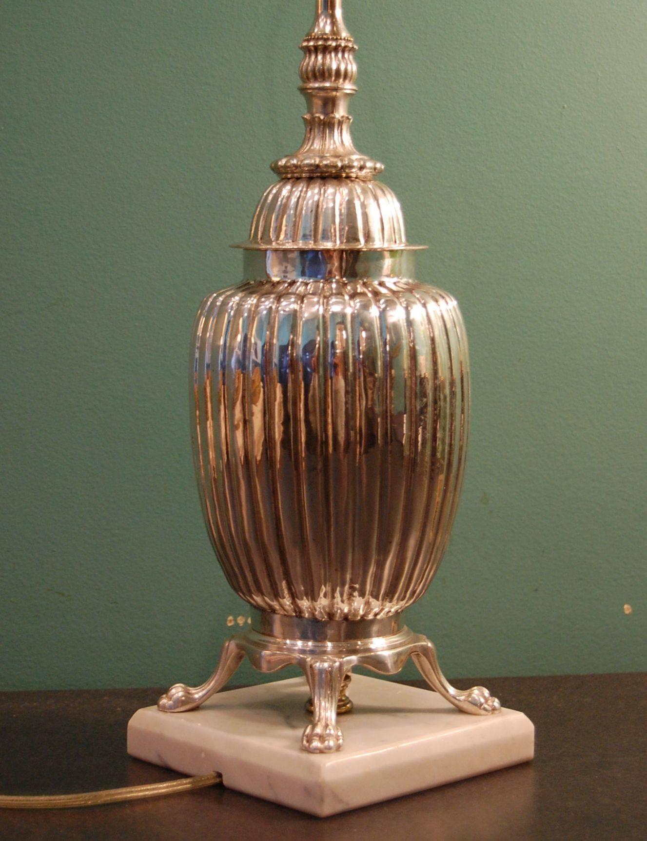 Silver plated tea caddie urn on marble base, just cleaned, polished and lacquered. New wiring with a three way socket. It is 15 inches to the bottom of the socket.