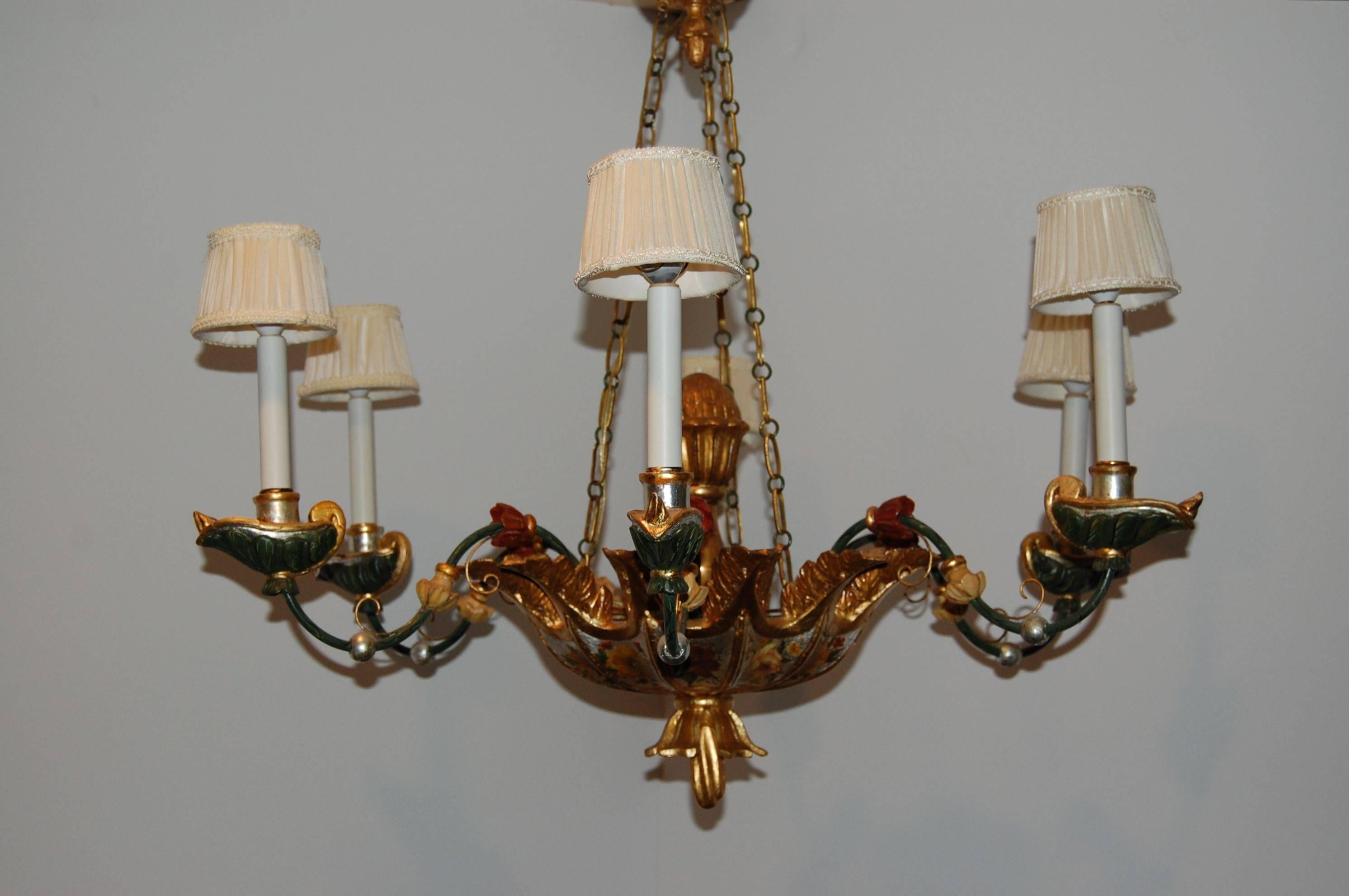 Early carved wood Venetian polychromed six-light chandelier in excellent condition. Recently cleaned and rewired with minor touch-up done to the finish. The bobache are carved to simulate Roman oil lamps, finished in gold leaf and multicolored