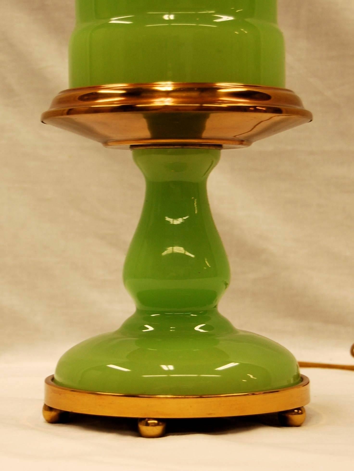 green glass oil lamp