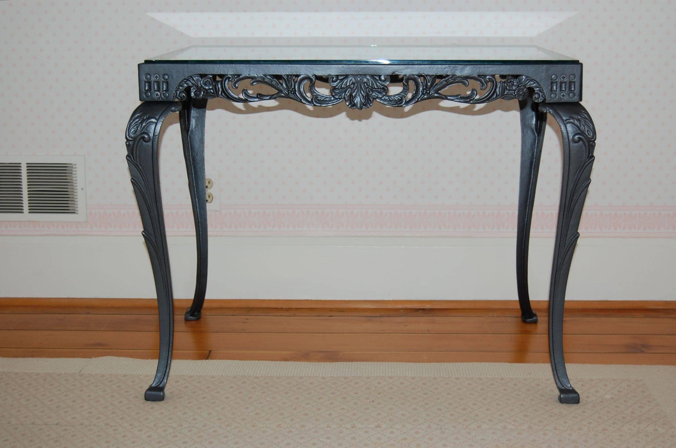 Beautiful cast iron table has just been powder coated in a dark gun metal finish.