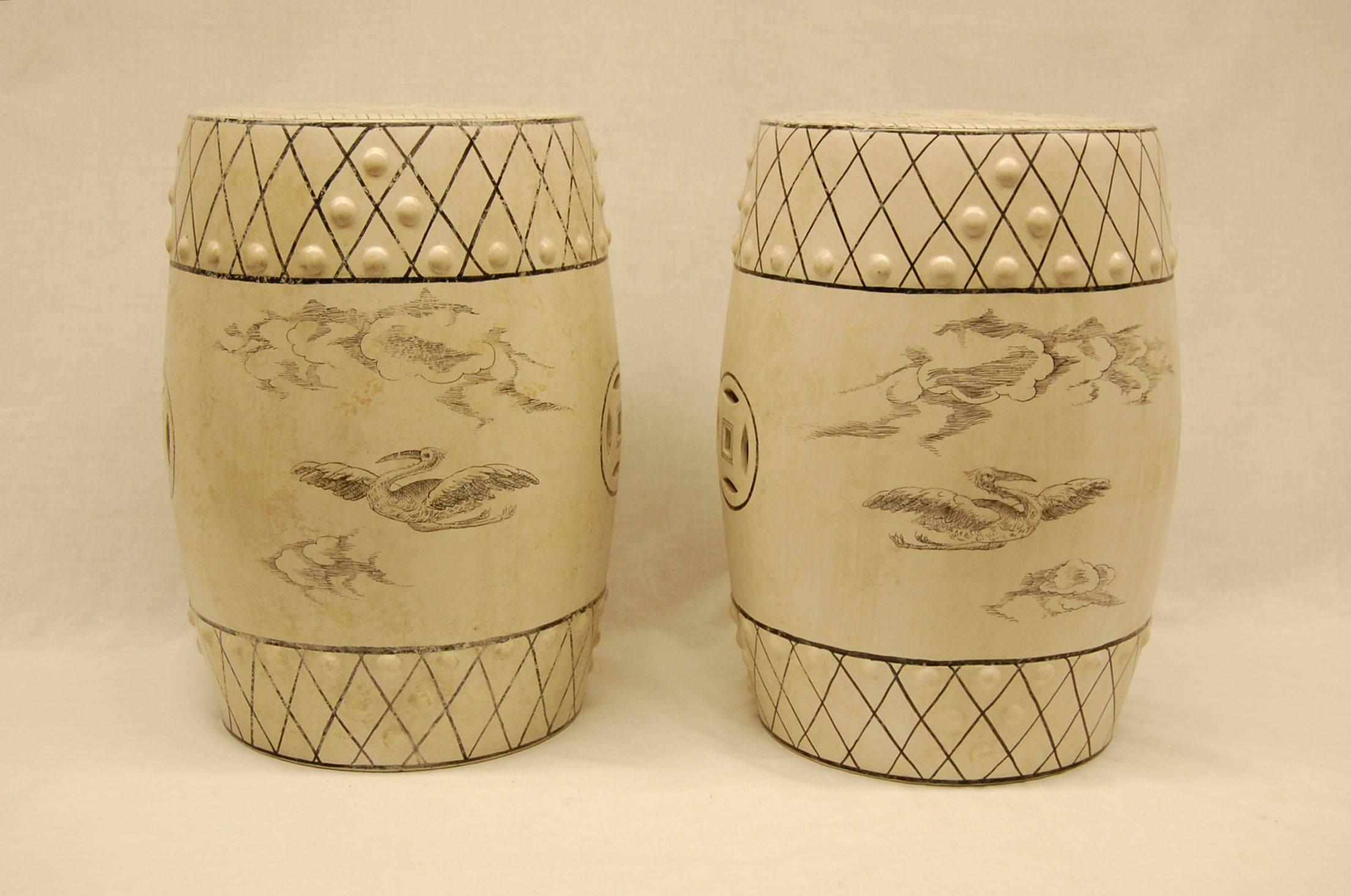 White glazed porcelain seats with scenes of hunting dogs attacking a boar, as well as birds flying. Excellent condition, age and origin unknown but likely, early 20th century.
