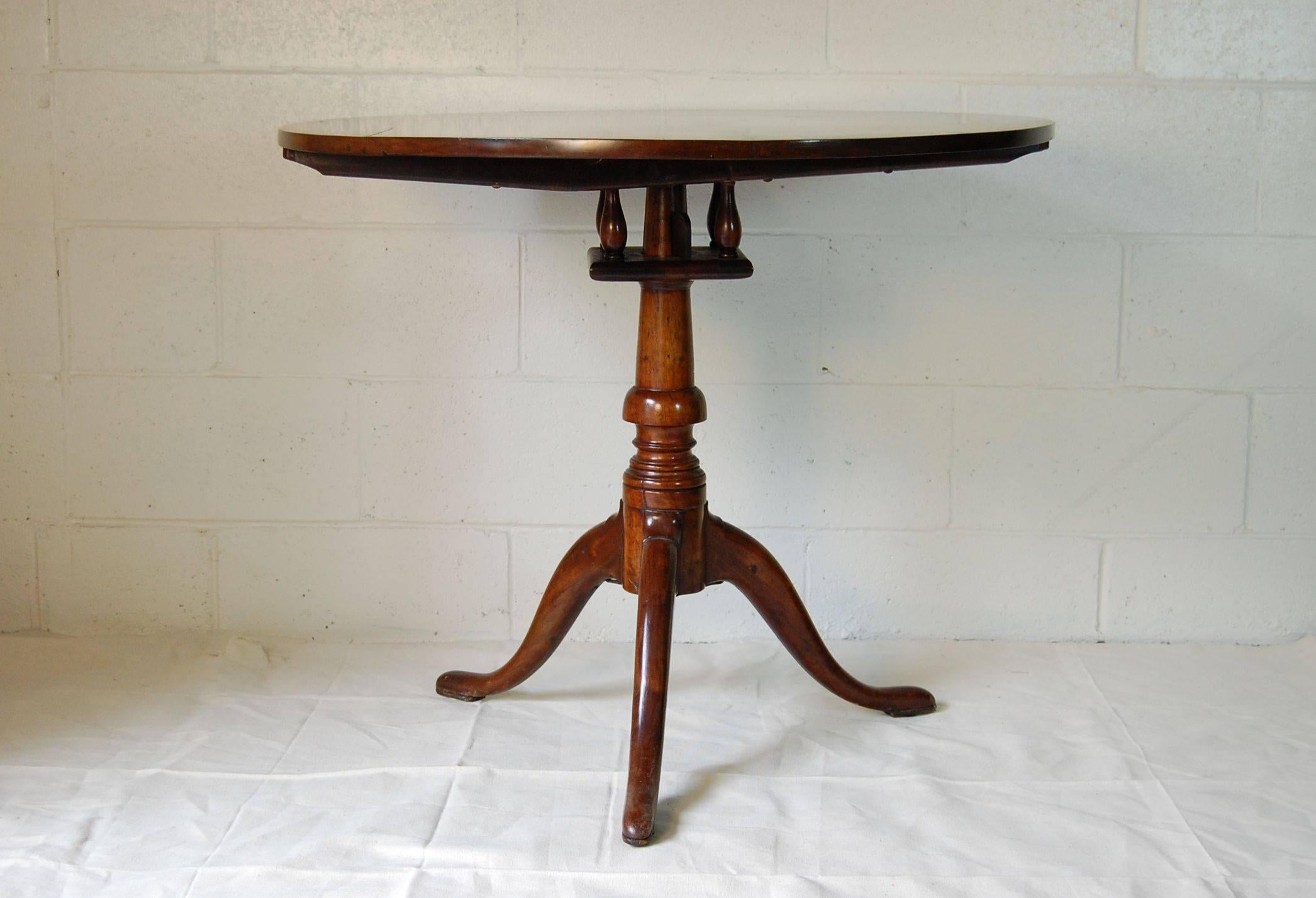 Late 18th-early 19th century mahogany tilt-top table in excellent condition with original hardware.