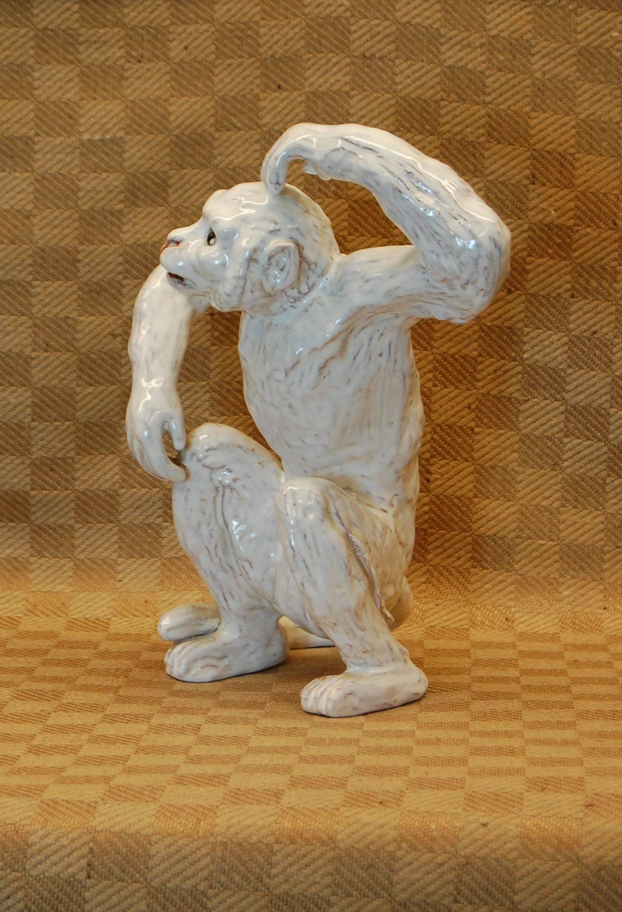 20th Century Two 19th Century French Glazed Terracotta Monkeys, One Seated and One Hanging For Sale