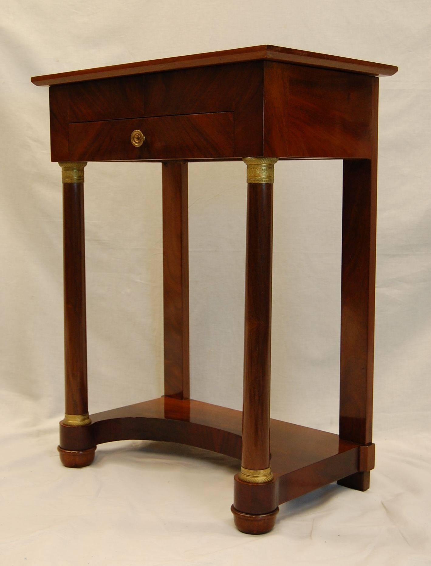 Wonderful mahogany sewing table with lift up lid and mirror underneath exposing a divided interior area.