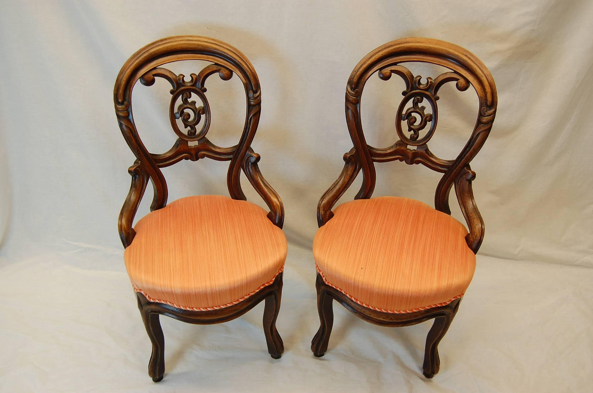 Pair of Walnut chairs in excellent condition, currently covered in a strie' Salmon cotton. Springs and structure are in excellent condition. From the estate of Herbert I. Frank, a 19th century Pittsburgh industrialist.