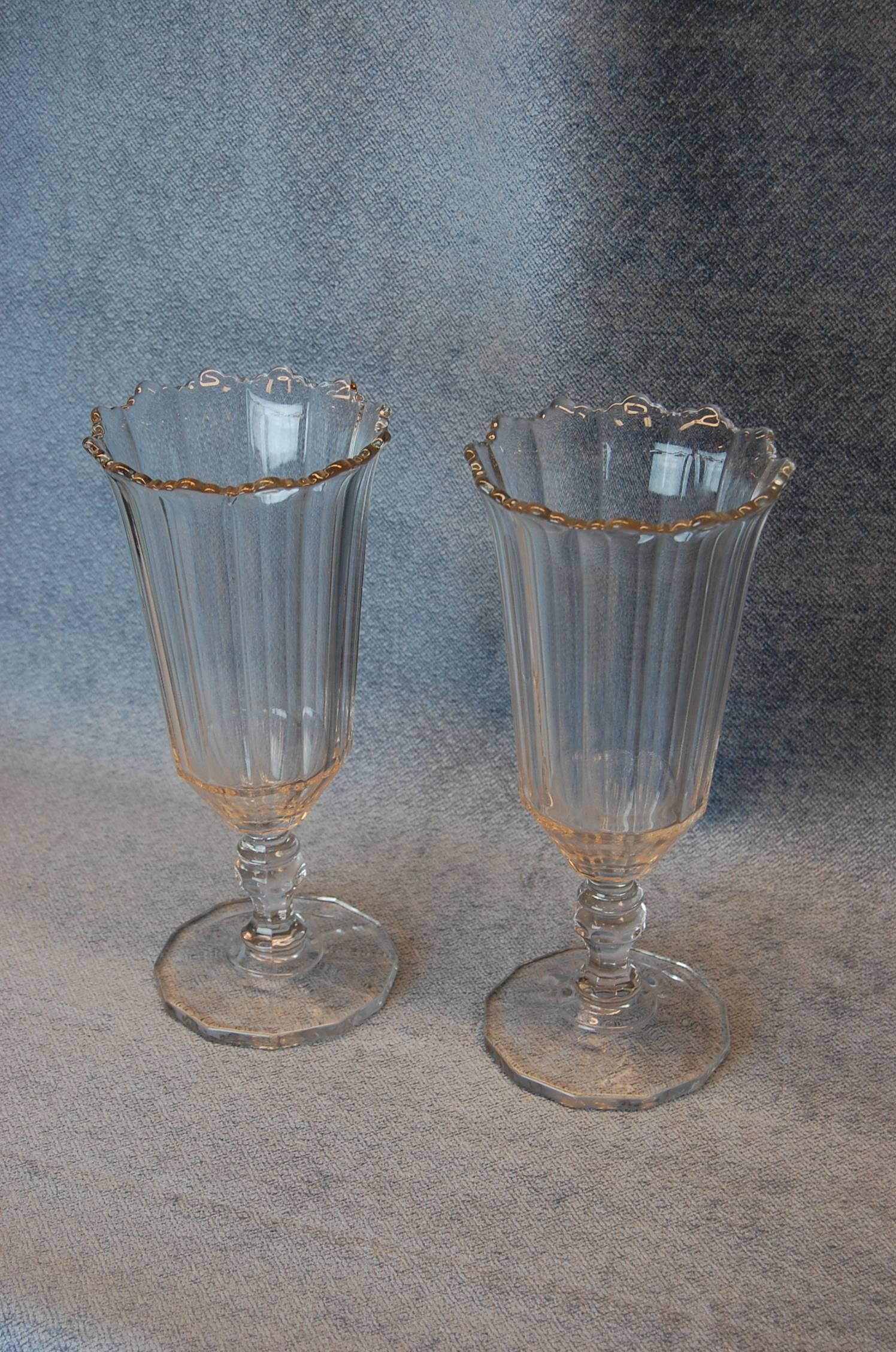 Pair of clear glass vases standing 9 3/8 inches tall, 4 1/4 inch top diameter. Excellent condition.
